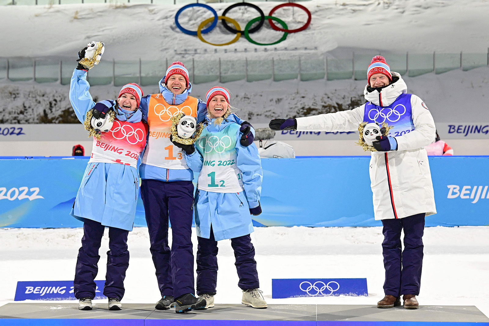 From left, Marte Olsbu Roeiseland, Johannes Thingnes Boe, Tiril Eckhoff and Tarjei Boe celebrate during the medal ceremony on Saturday.