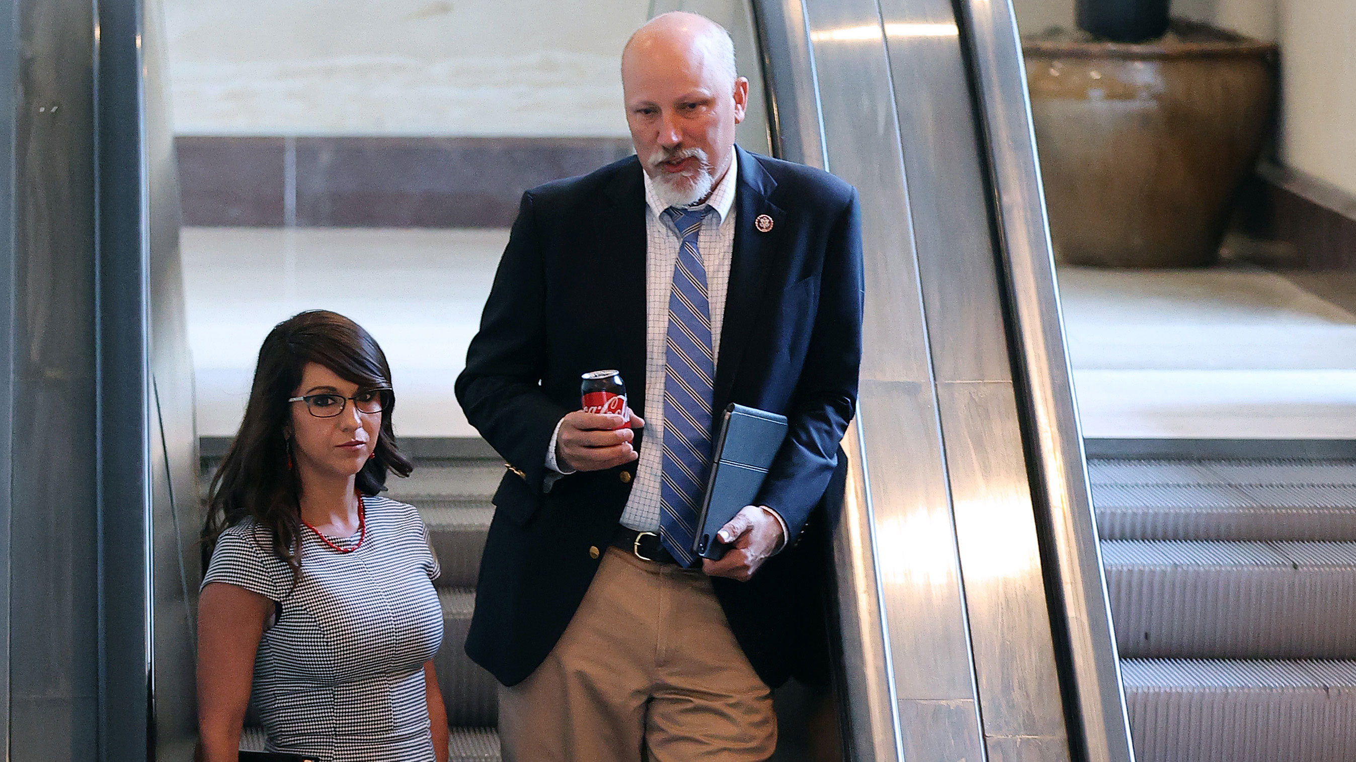 Reps. Lauren Boebert, left, and Chip Roy are pictured on their way to a meeting in the US Capitol Visitor Center on May 14, 2021.