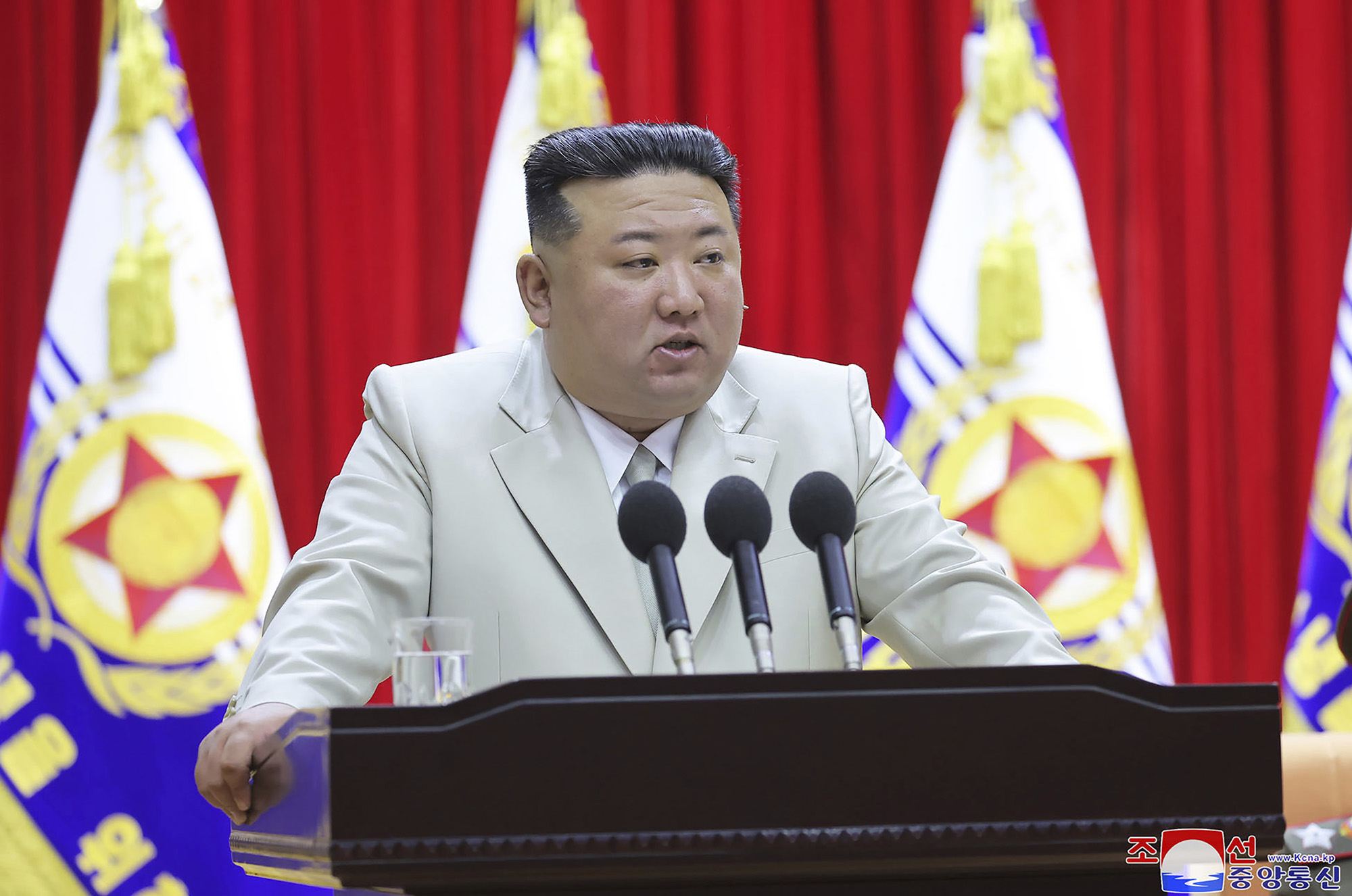 North Korean leader Kim Jong Un speaks during his visit to the navy headquarters in North Korea on August 27, in this government hand out image.