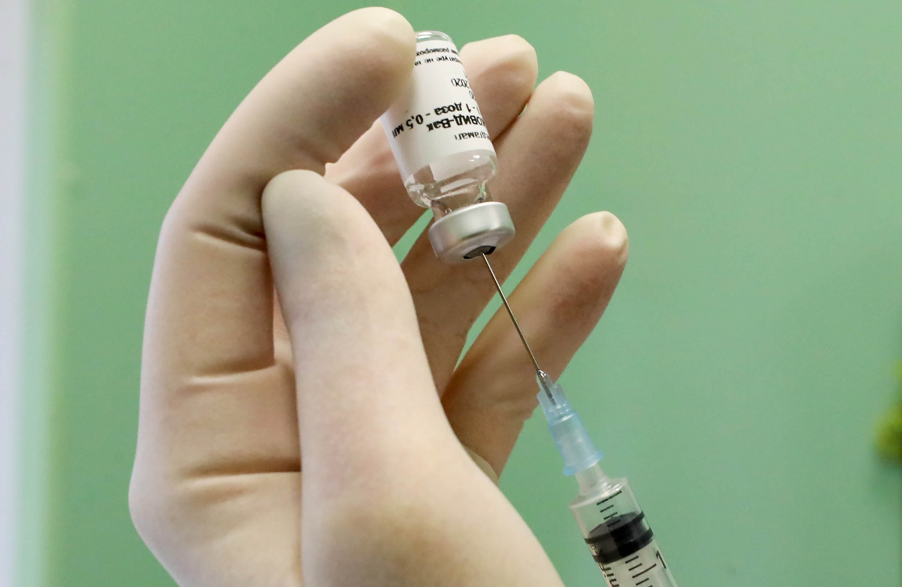 A medical worker prepares the Gam-COVID-Vak vaccine, also known as Sputnik V, for vaccination of medical staff at a hospital in St. Petersburg, Russia, on October 7.