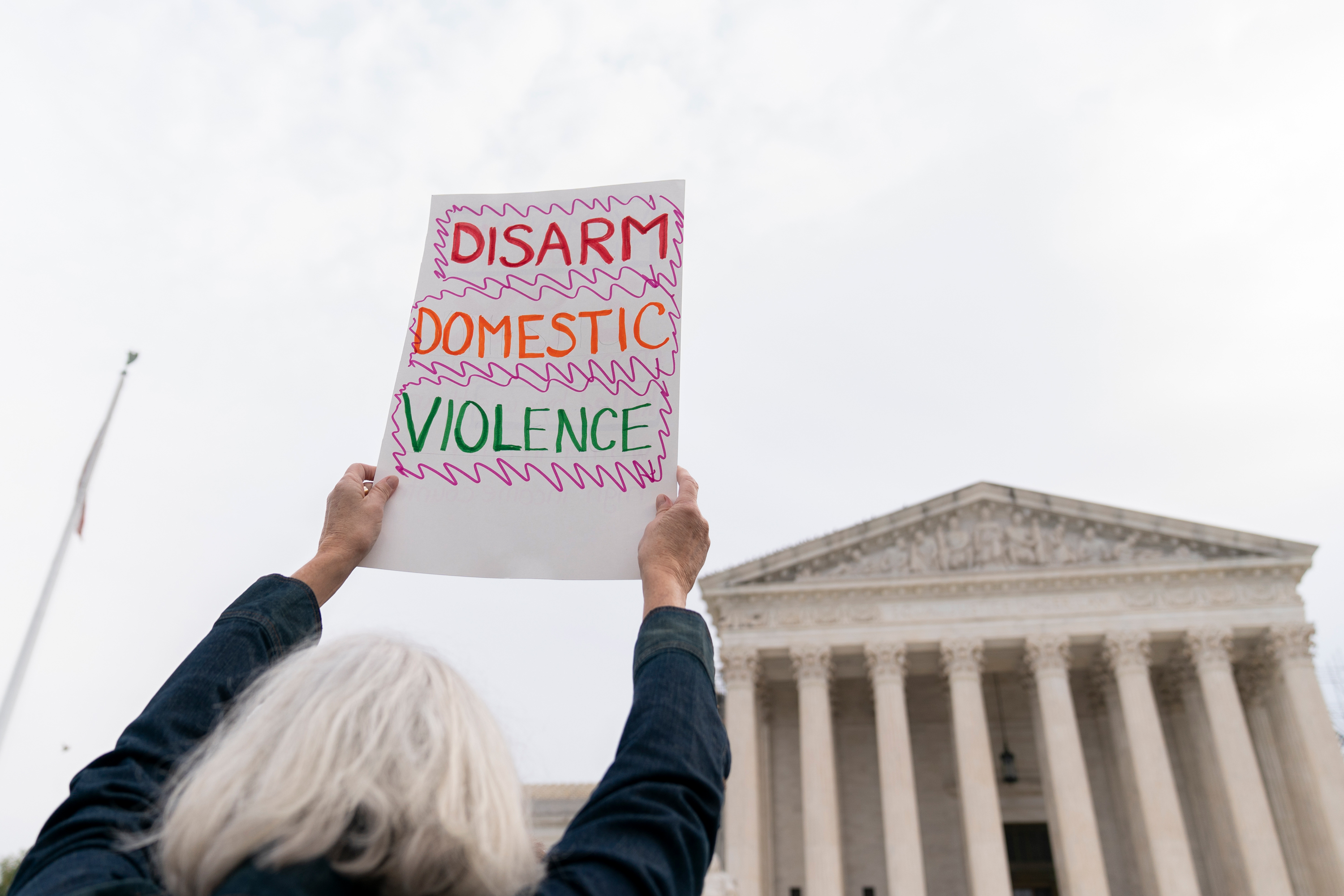 Gun safety and domestic violence prevention organizations gather outside of the Supreme Court before oral arguments are heard in United States v. Rahimi on November 7 in Washington, DC.
