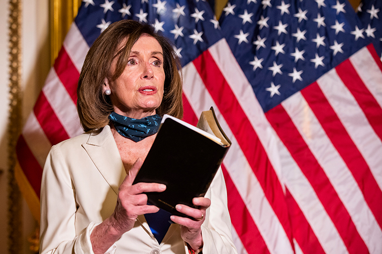 House Speaker Nancy Pelosi, reading from the Bible, reacts to President Donald Trump during a news conference at the U.S. Capitol in Washington, Tuesday, June 2.
