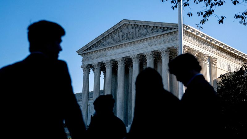 People wait in line outside the US Supreme Court in Washington, DC, on October 11, 2022.