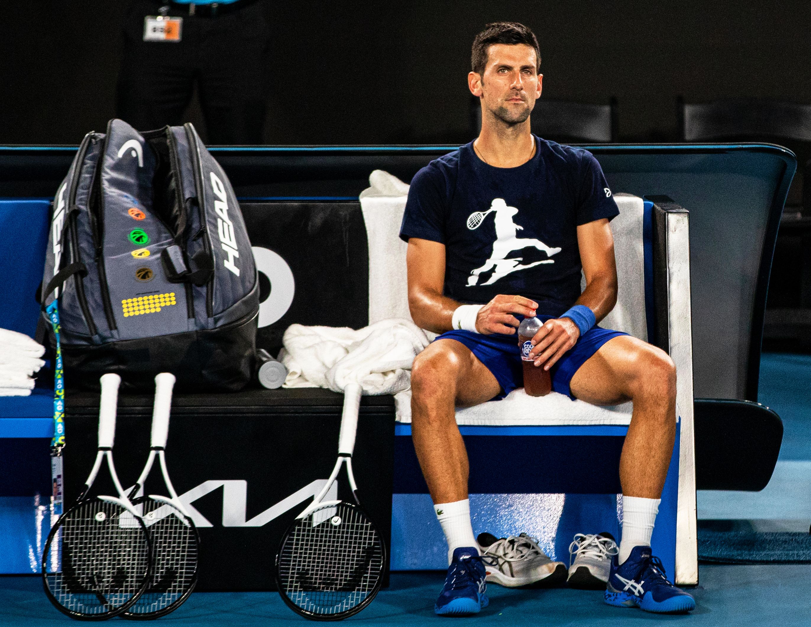 Novak Djokovic dari Serbia beristirahat selama sesi latihan menjelang turnamen tenis Grand Slam Australia Terbuka di Melbourne Park di Melbourne, Australia pada 14 Januari.