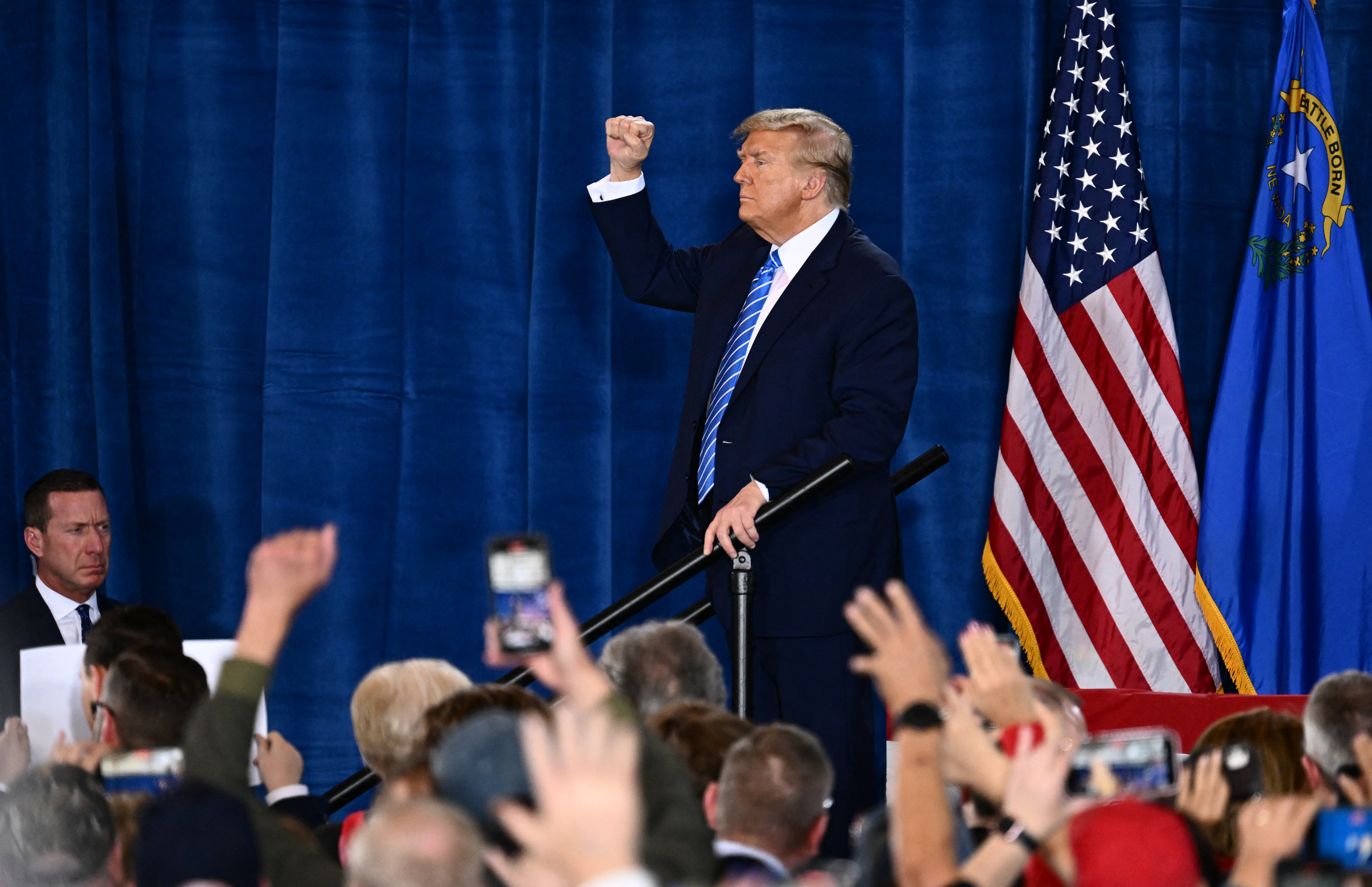 Former President Donald Trump raises his fist after speaking at a rally in Las Vegas on January 27.