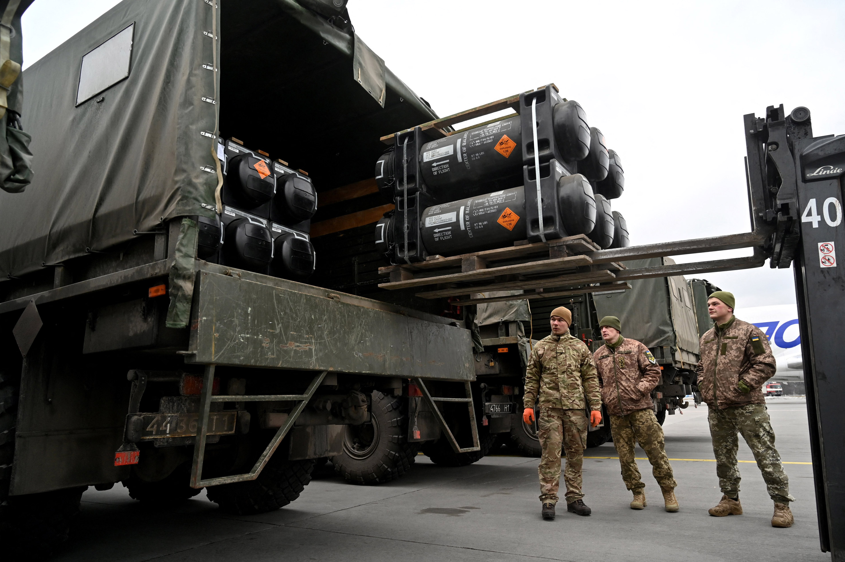 Ukrainian servicemen load a truck with American FGM-148 Javelins as they arrive at the Boryspil airport in Kyiv, on February 11.