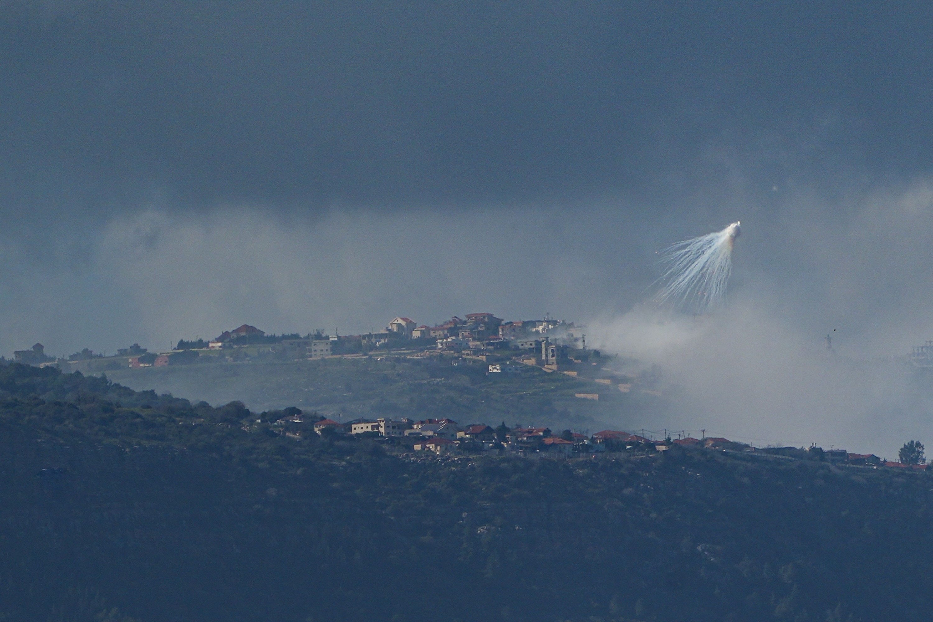 The Israeli army uses white phosphorus to create a smoke screen in Lebanon, as seen from Israel’s border, on March 4. 