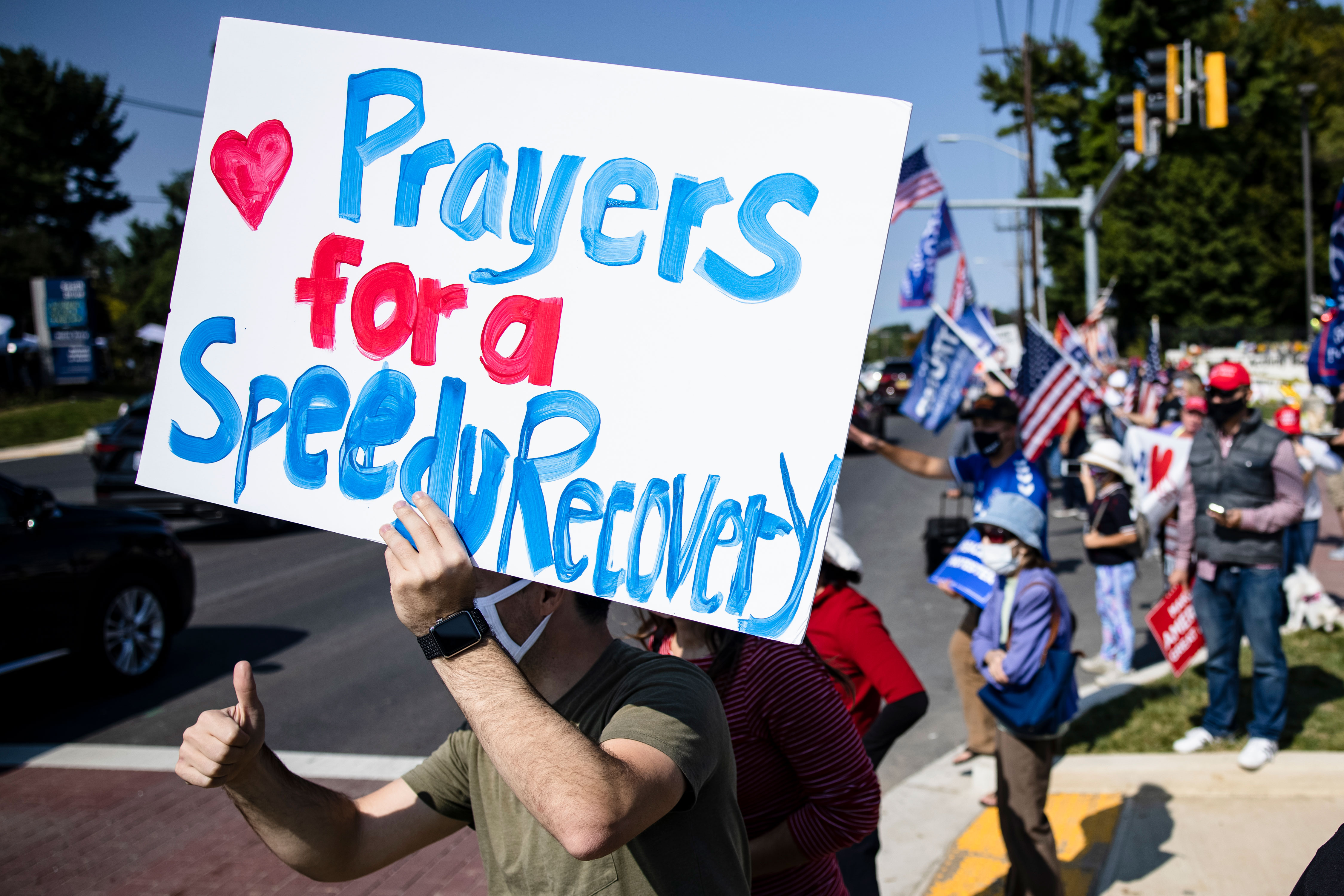 Supporters of President Donald Trump gather outside Walter Reed medical center in Bethesda, Maryland, on October 4.