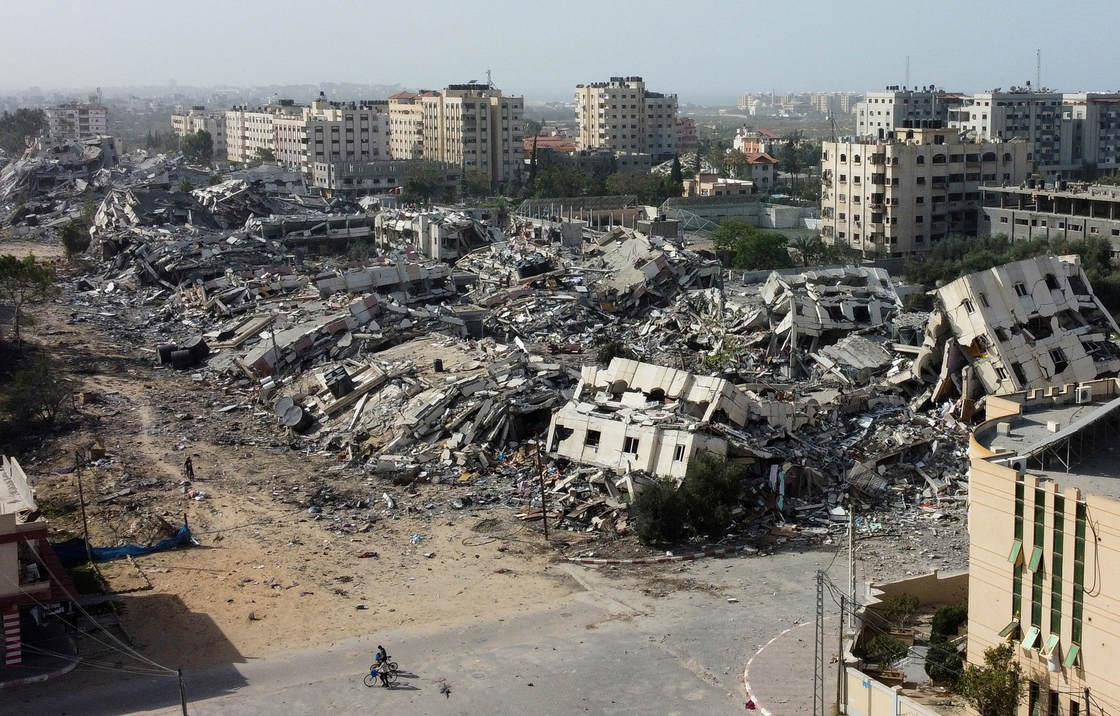 Residential buildings, destroyed in Israeli strikes during the conflict, lie in ruin, amid a temporary truce between Israel and Hamas, in southern Gaza City, on November 26.
