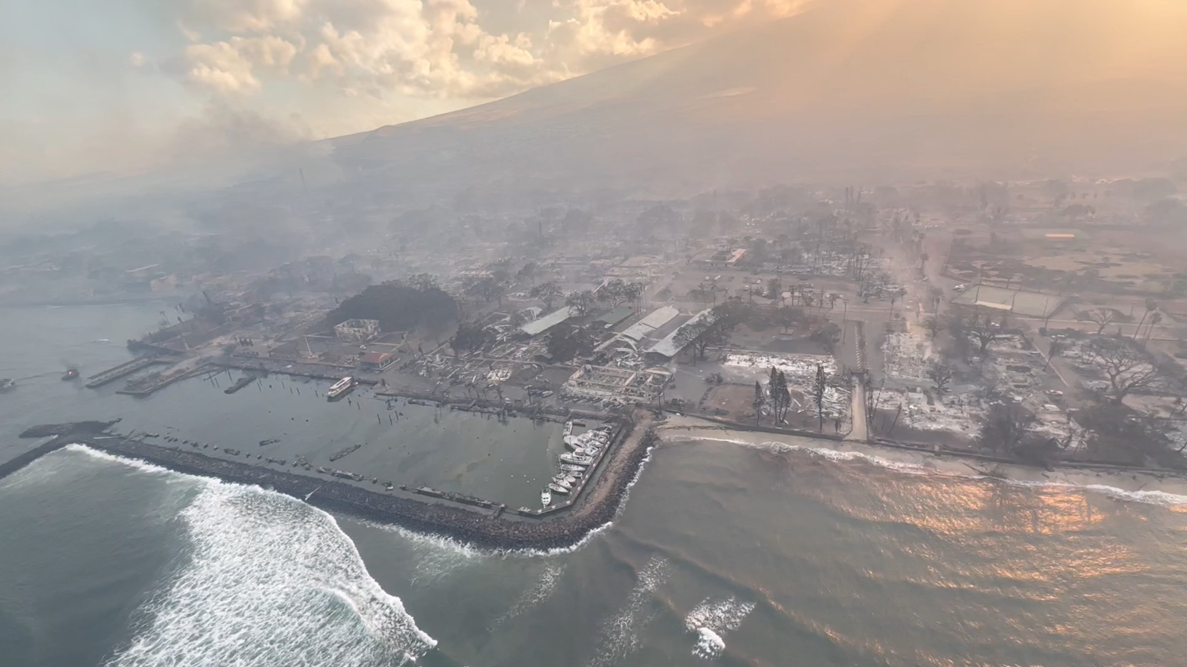 An aerial view of damaged areas amidst wildfires in Maui, Hawaii, on August 9, 2023, in this screenshot taken from a social media video.