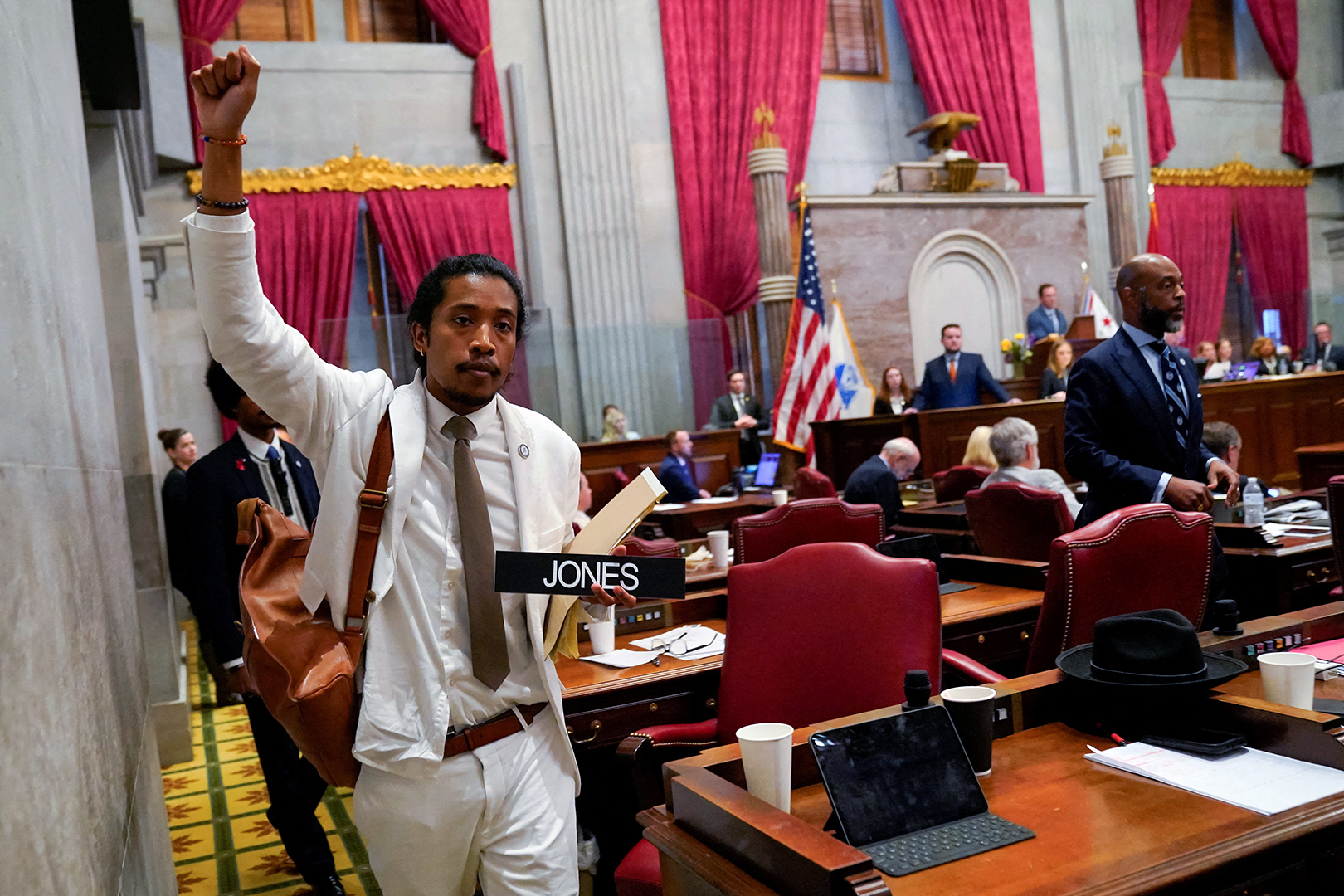 Justin Jones carries his name tag after a vote at the Tennessee House of Representatives to expel him for his role in a gun control demonstration at the statehouse in Nashville.
