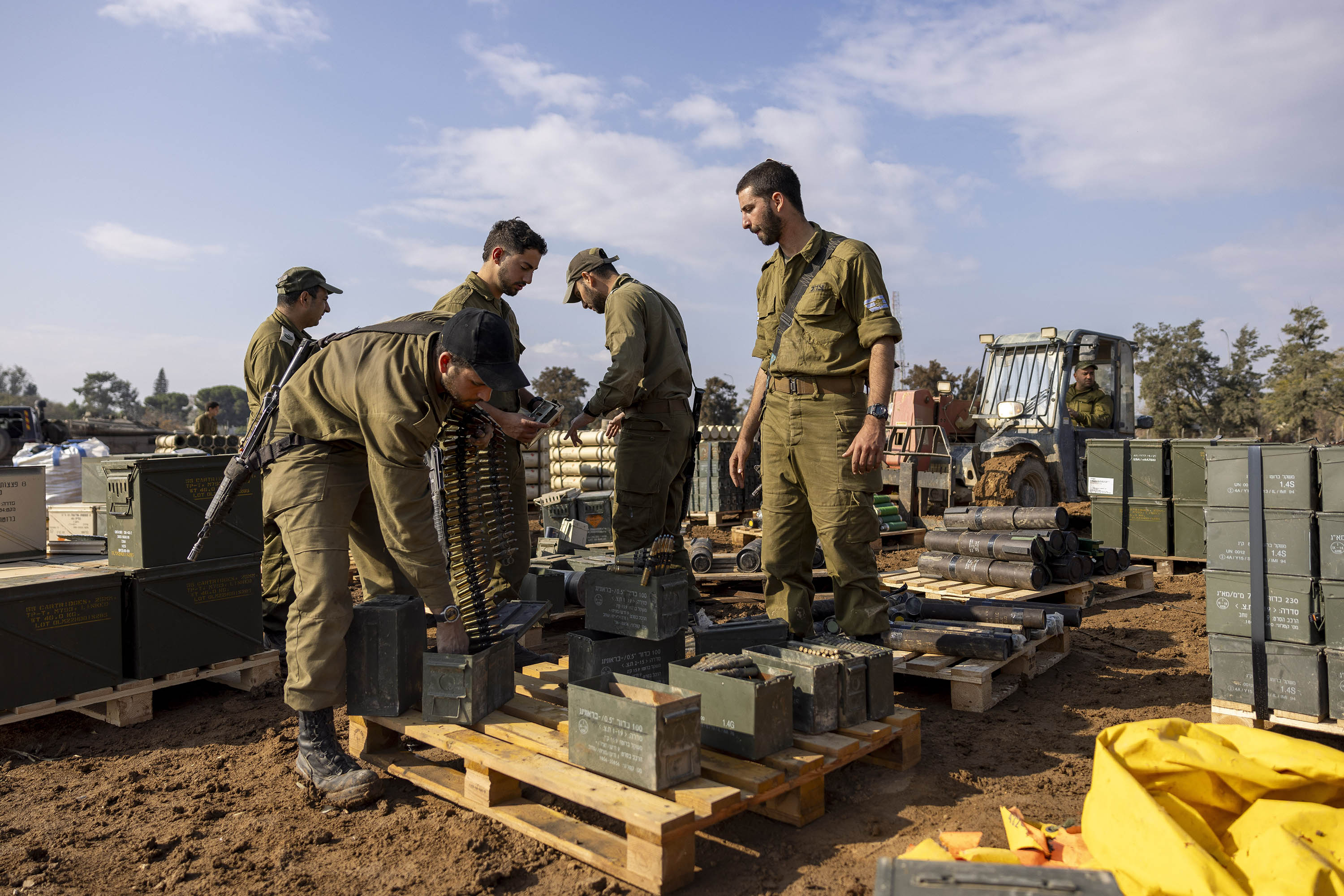 Israeli soldiers pack ammunition at a staging area in southern Israel, near the border with Gaza, on January 2. 