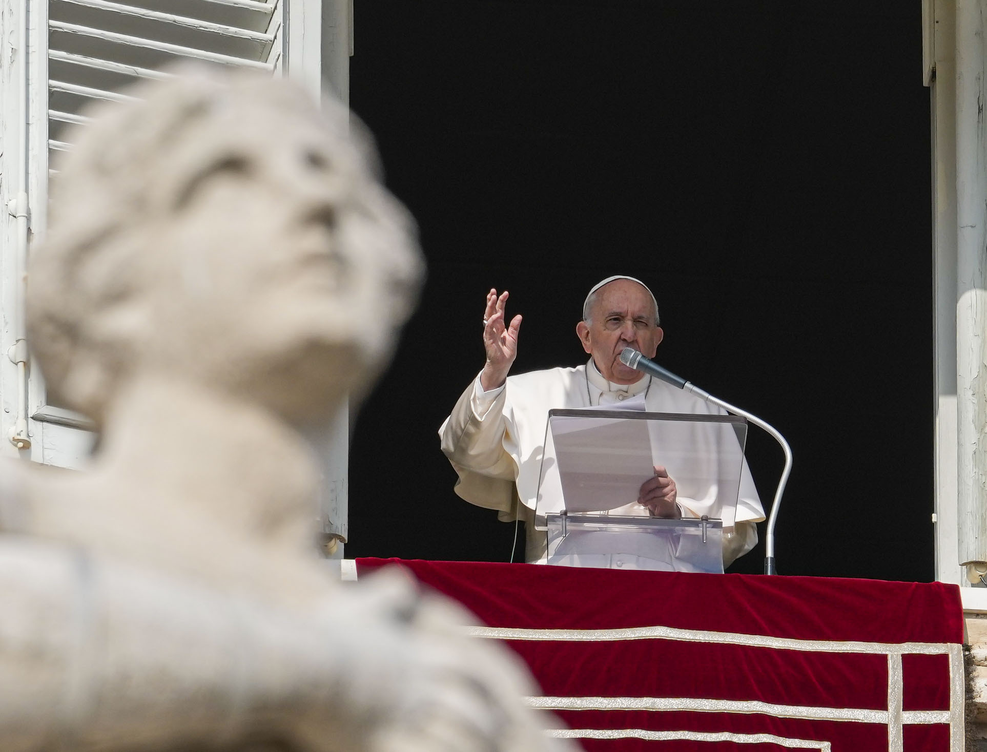 Pope Francis speaks to pilgrims and worshippers gathered in St. Peter's Square in the Vatican City on Sunday. 