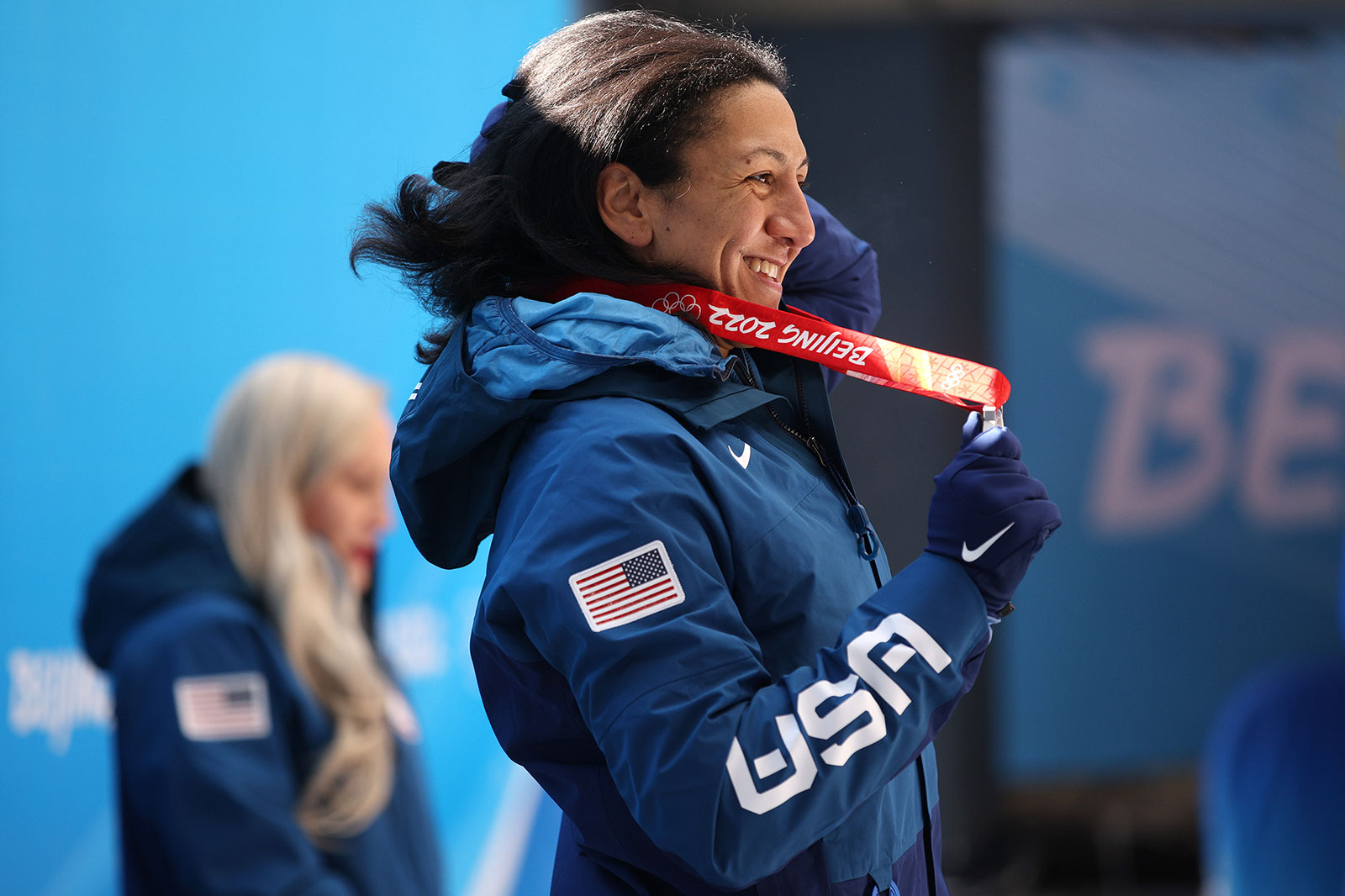 Elana Meyers Taylor accepts her silver medal during the medal ceremony for the women's monobob event on February 14.