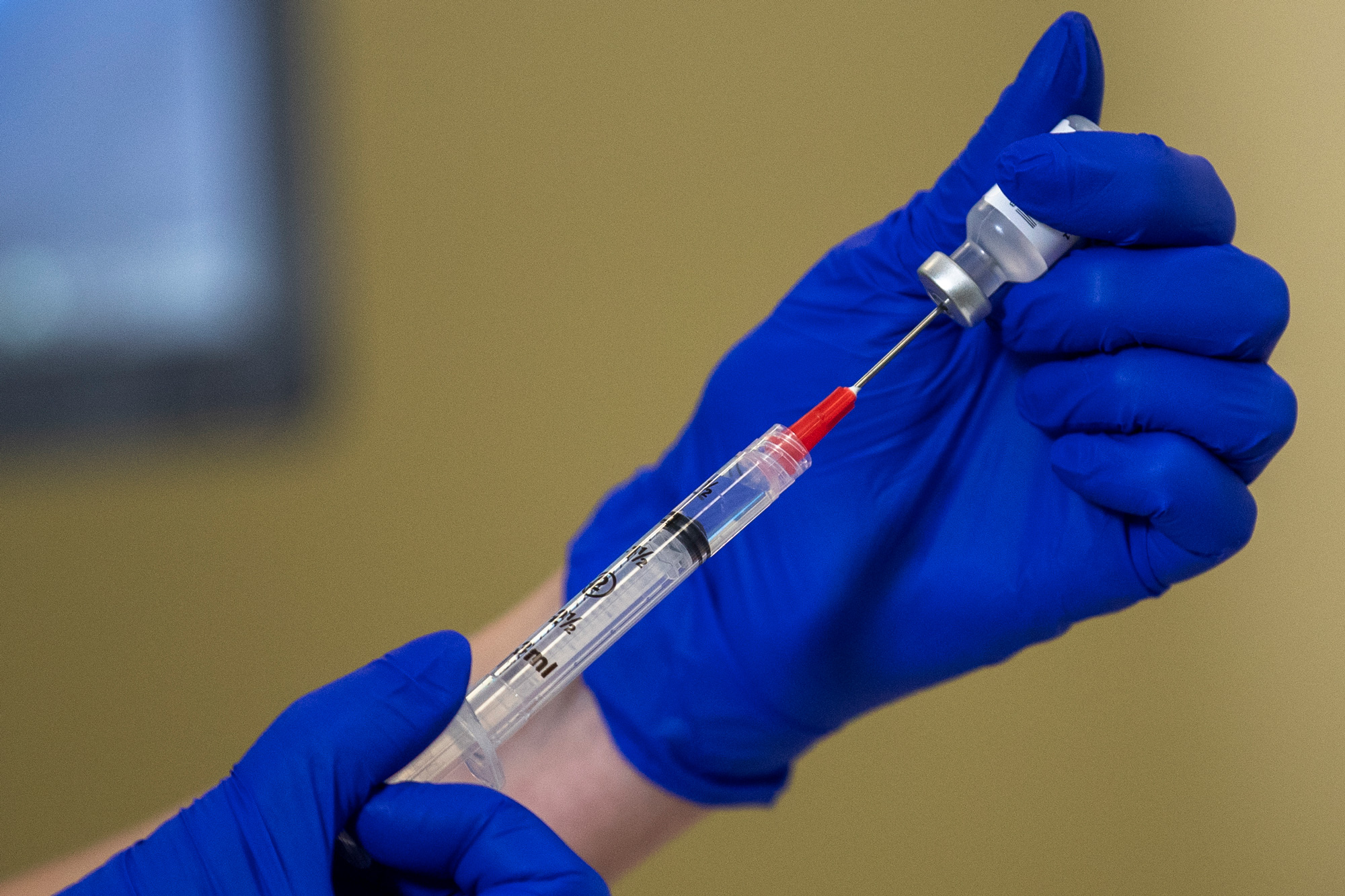 The Pfizer-BioNTech COVID-19 vaccine is prepared prior to a vaccine event at Kaiser Permanente Capitol Hill Medical Center on December 17 in Washington, DC. 