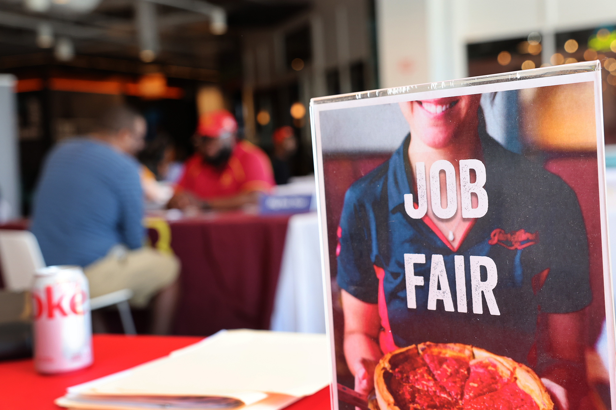 Job seekers speak with recruiters during a job fair at Navy Pier on April 11 in Chicago, Illinois. 