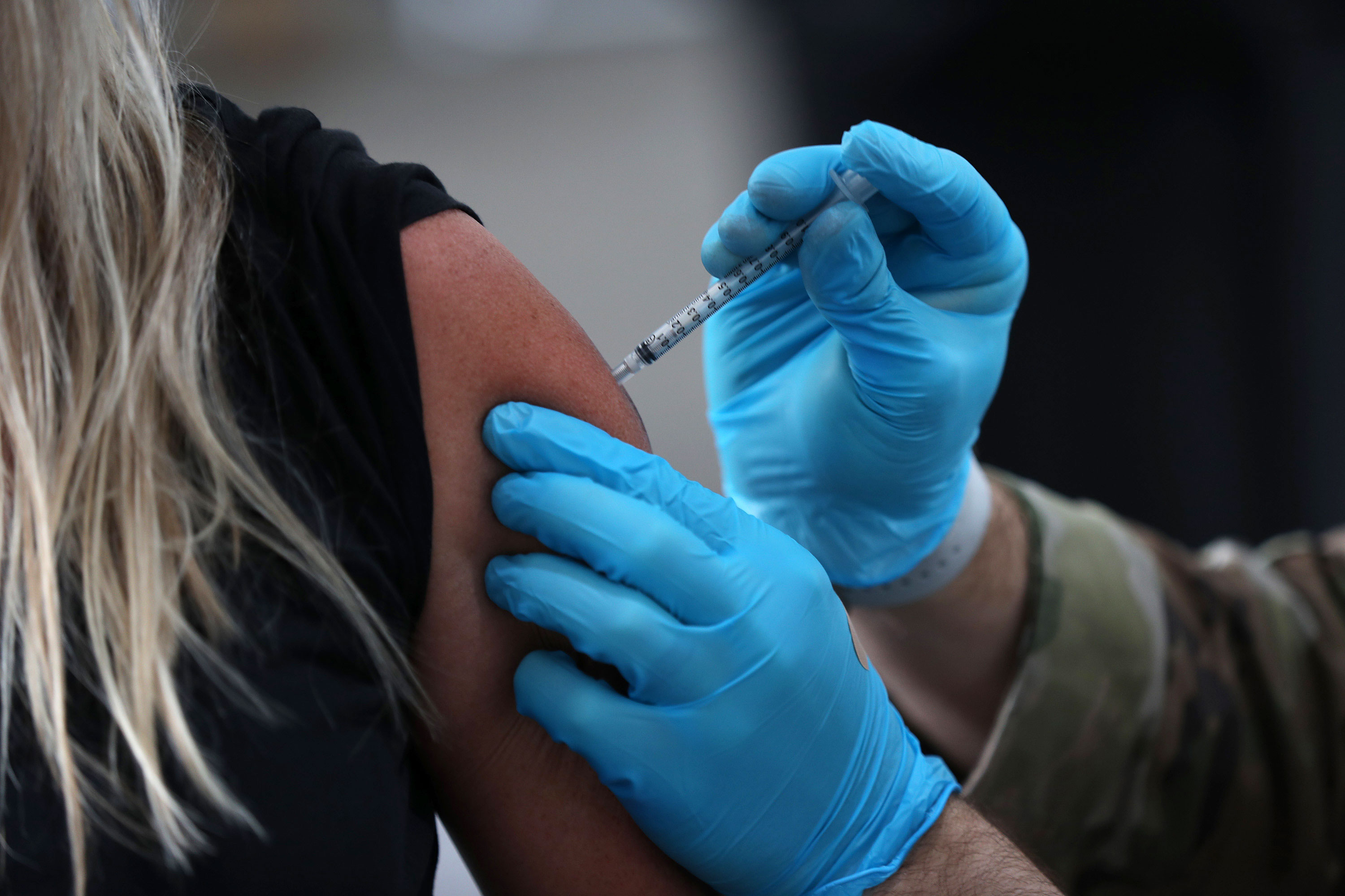 A person receives a Covid-19 vaccine on March 9 in North Miami, Florida.