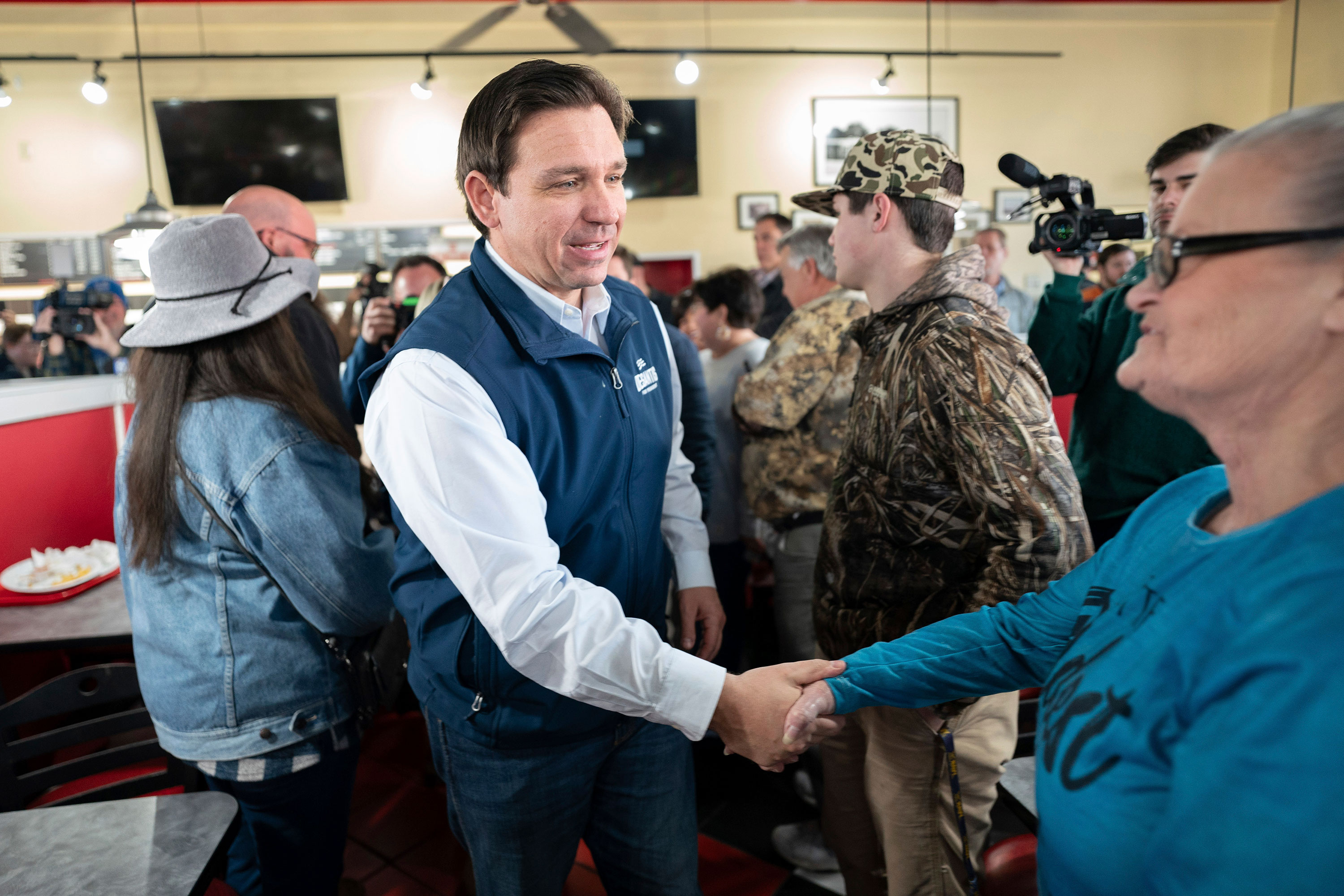Florida Gov. Ron DeSantis greets people during a campaign event in Florence, South Carolina, on Saturday. 