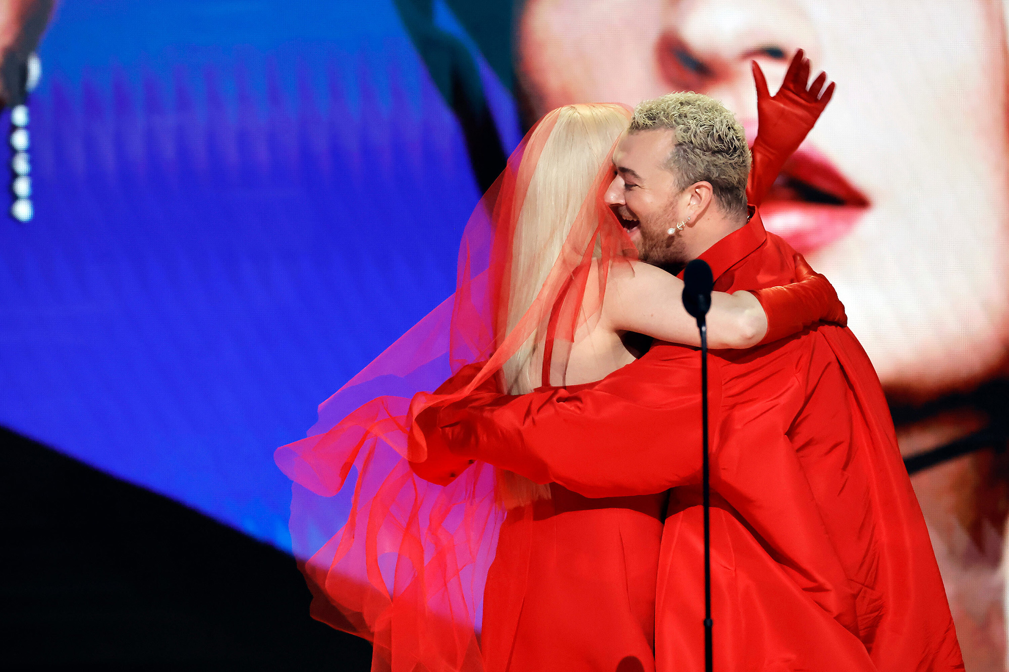 Kim Petras and Sam Smith celebrate after winning the Grammy for best pop duo or group performance ("Unholy"). Petras, who is transgender, gave the acceptance speech on the duo's behalf. She thanked "all the transgender legends before me who kicked these doors open for me."