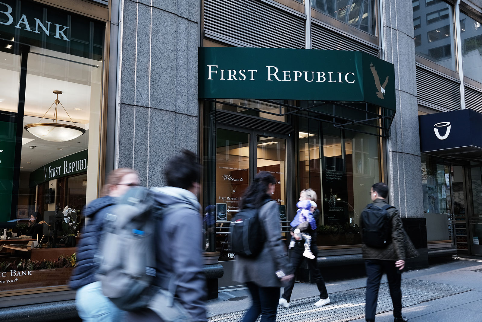 People walk past a First Republic Bank in New York City on May 1. 