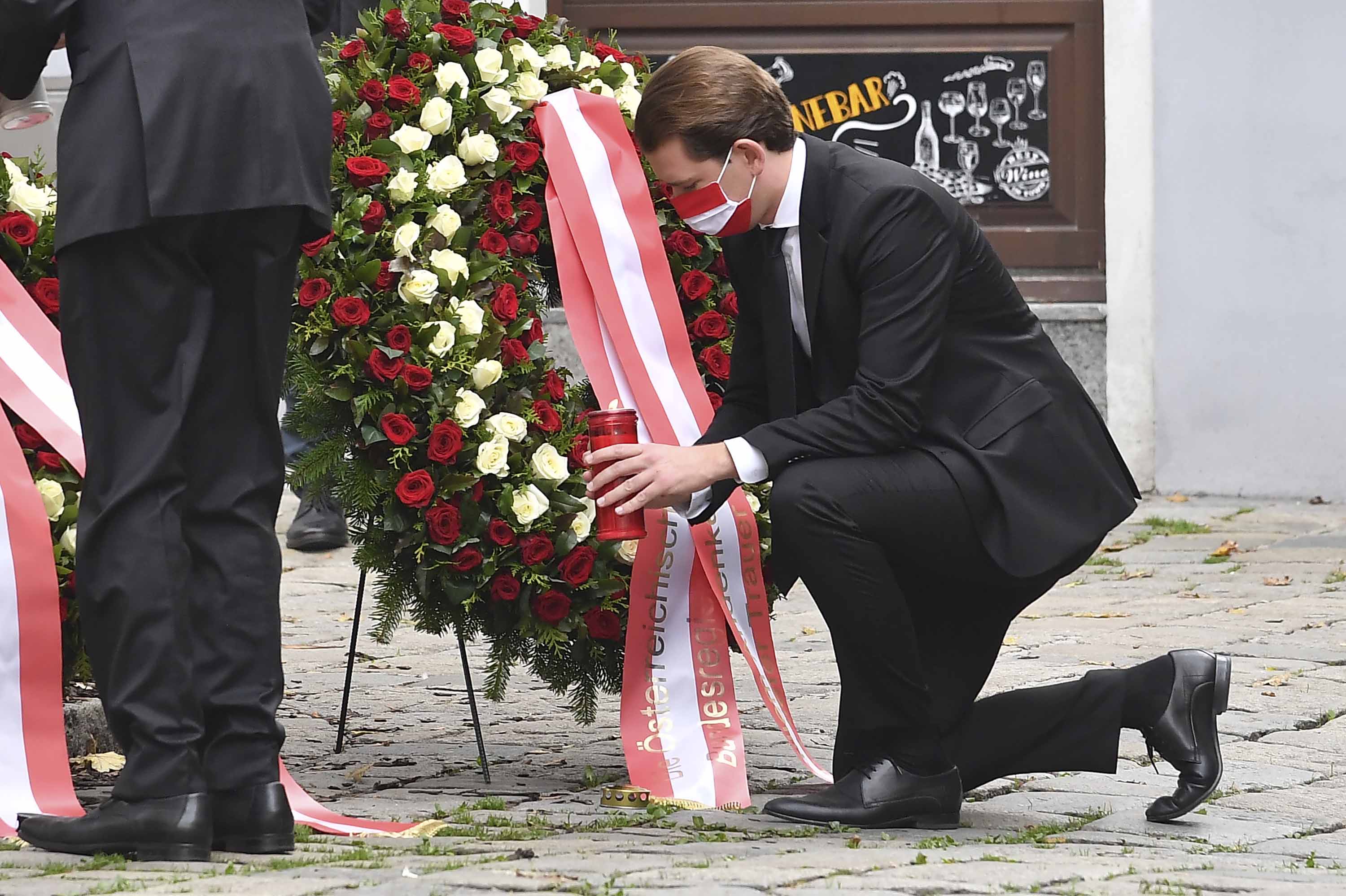 Austrian Chancellor Sebastian Kurz places a candle as he pays his respects to the victims of the shooting in Vienna, on November 3.