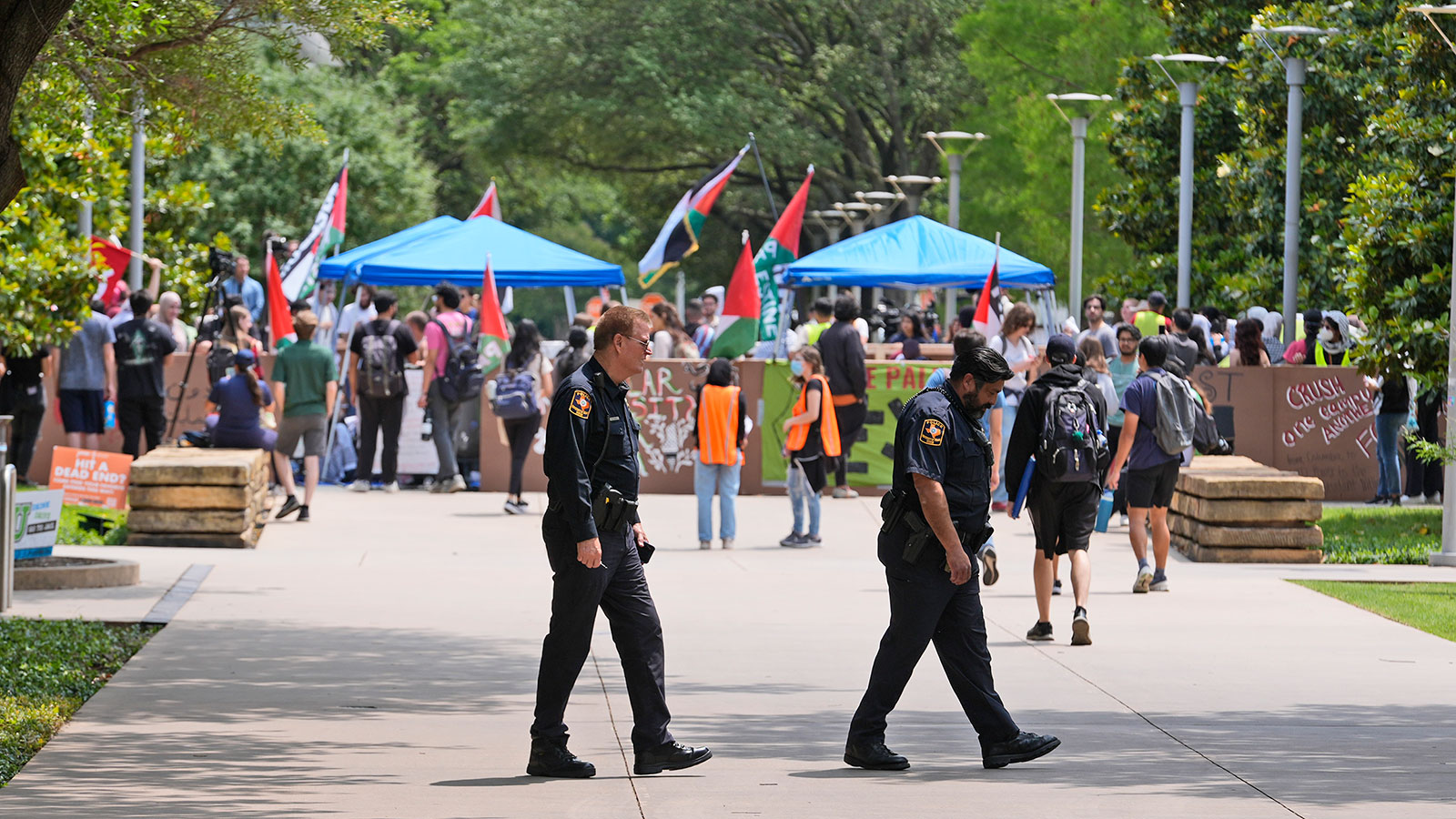 People gather against the Israel-Hamas war during a protest set up at the University of Texas at Dallas, Wednesday, May 1, in Richardson, Texas. 