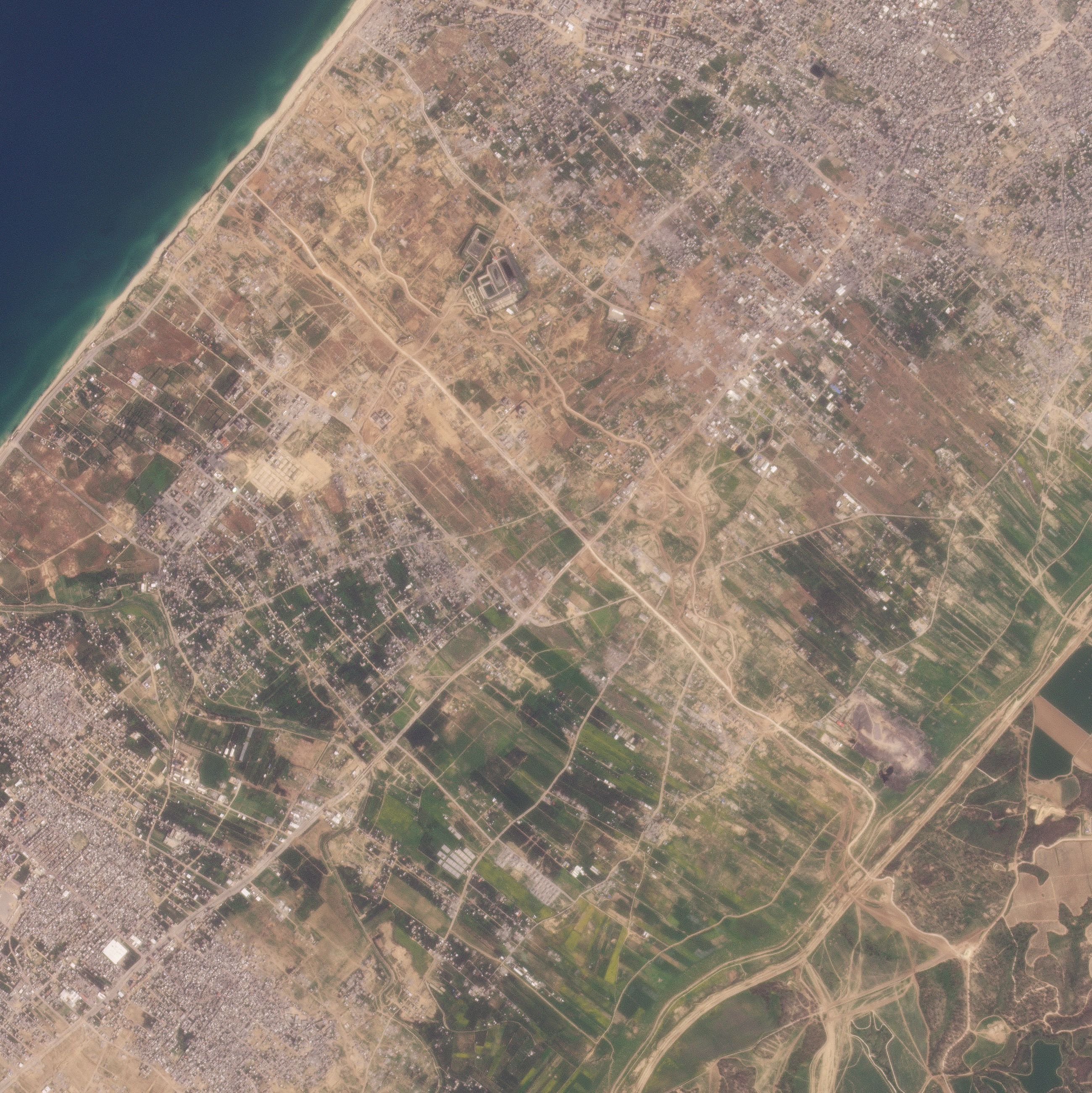 A satellite image shows a road being built by the Israeli military in Gaza.