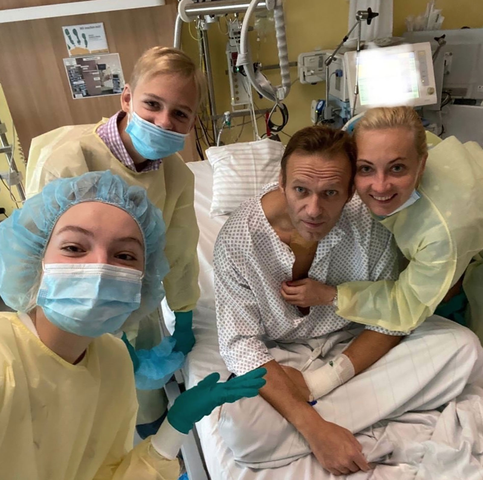 Navalny is surrounded by his wife, Yulia, and two children, Zakhar and Daria, while on a hospital bed in Berlin in September 2020. On social media, he said he was breathing on his own without medical support.