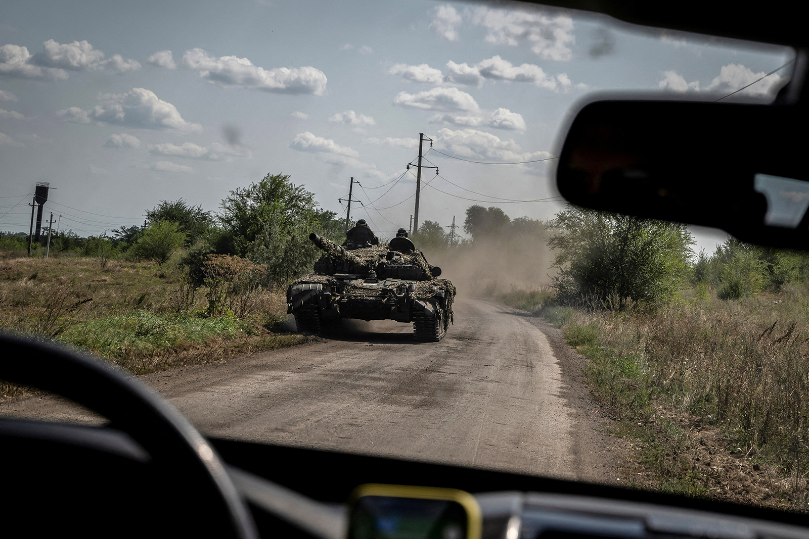 Ukrainian servicemen ride a tank near the village of Robotyne, Ukraine, on August 25. 