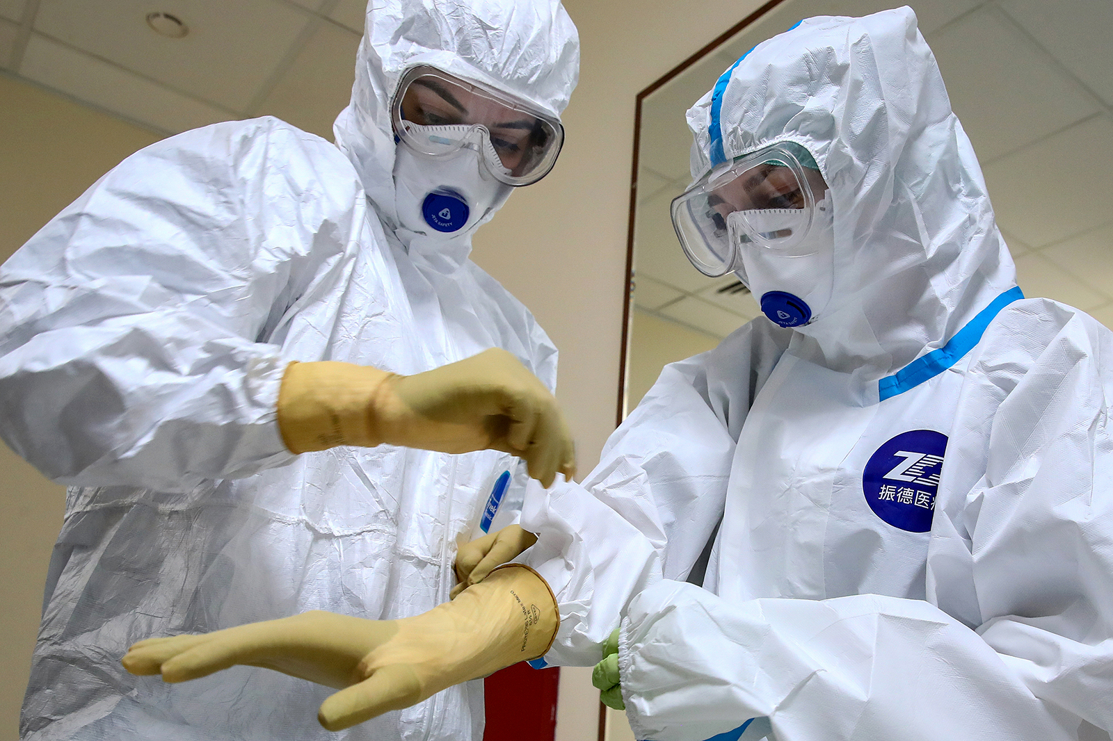 Healthcare workers put on personal protective equipment in Moscow, Russia on April 26. 