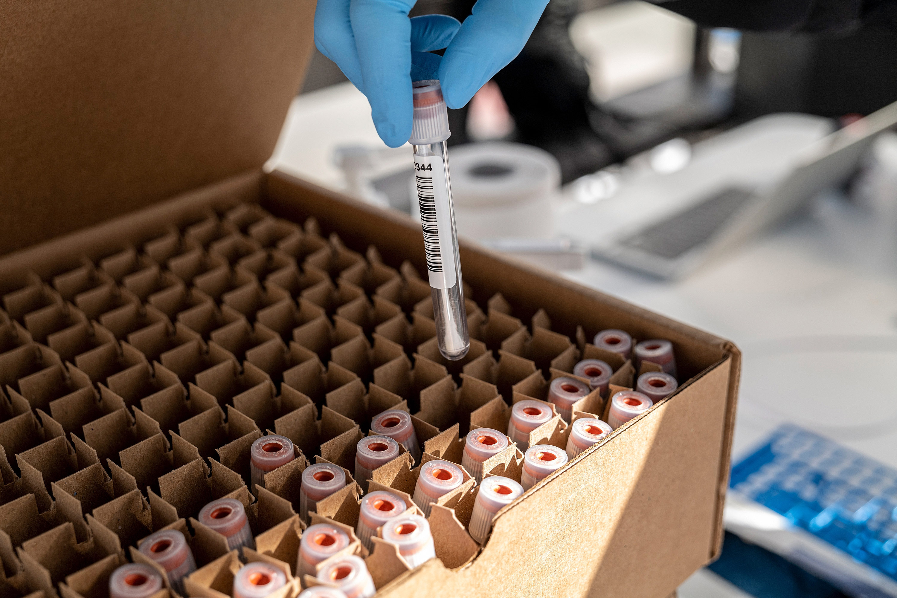 A health care worker places a vial containing a Covid-19 test swab into a box at a testing site in San Francisco, California, on January 9. 