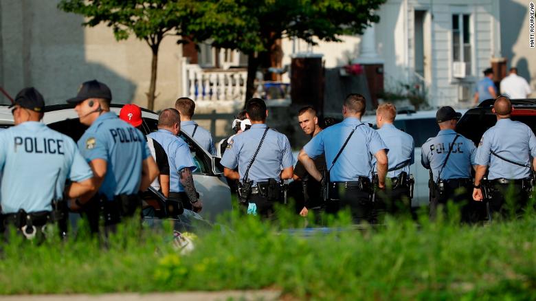 Authorities stage as they respond to an active shooting situation, Wednesday, Aug. 14, 2019, in the Nicetown neighborhood of Philadelphia. 