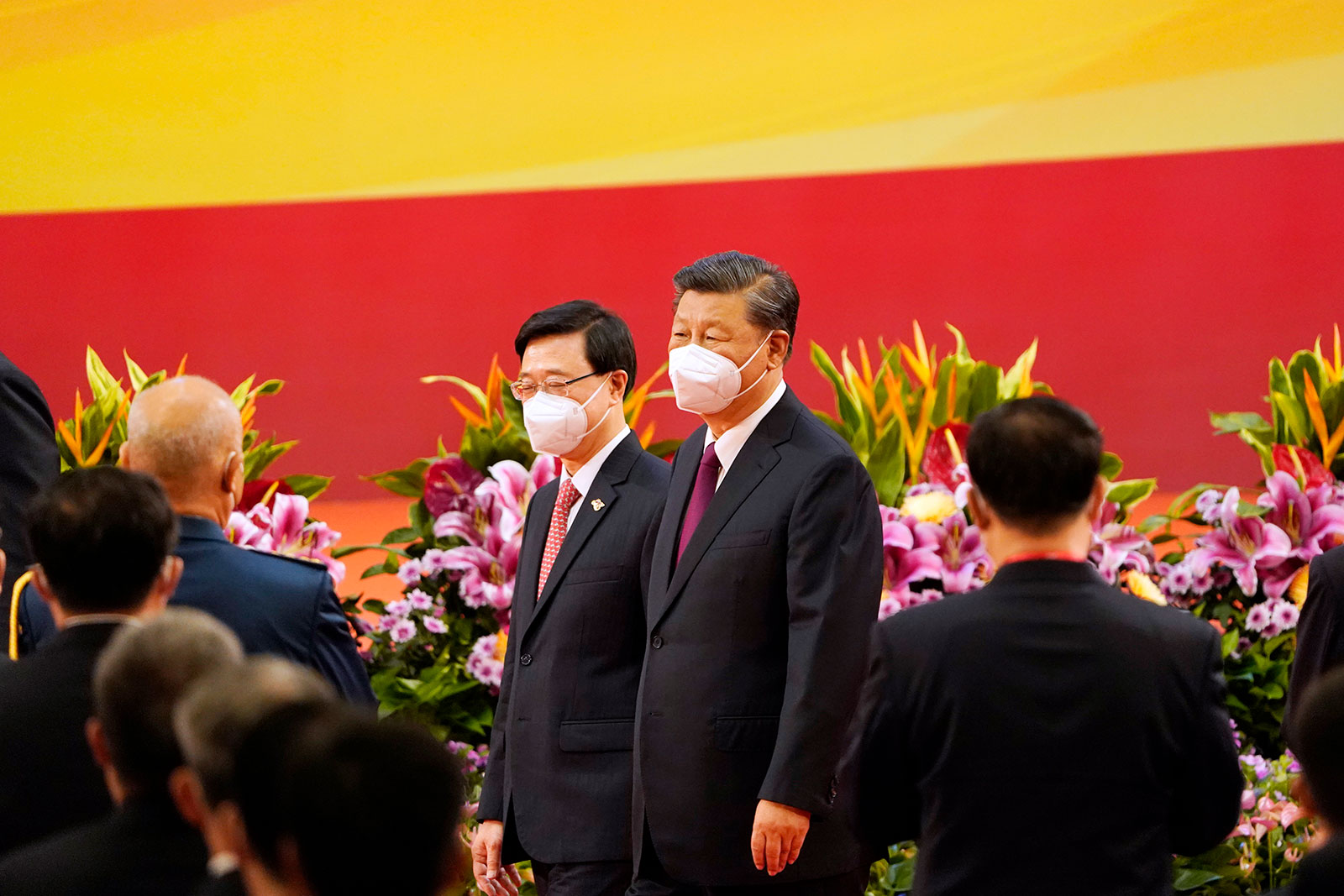 Chinese leader Xi Jinping arrives at a swearing-in ceremony for Hong Kong's new Chief Executive John Lee, left, in Hong Kong on Friday, July 1.