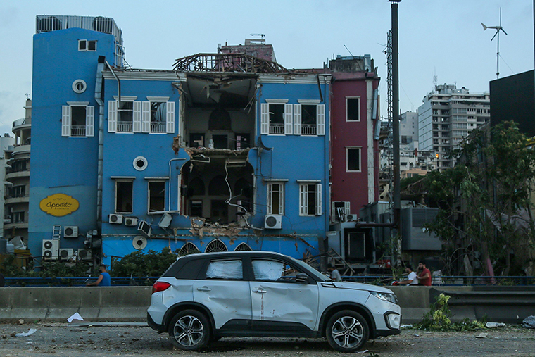 A view of a damaged street and buildings caused by a massive explosion in Beirut's port.  