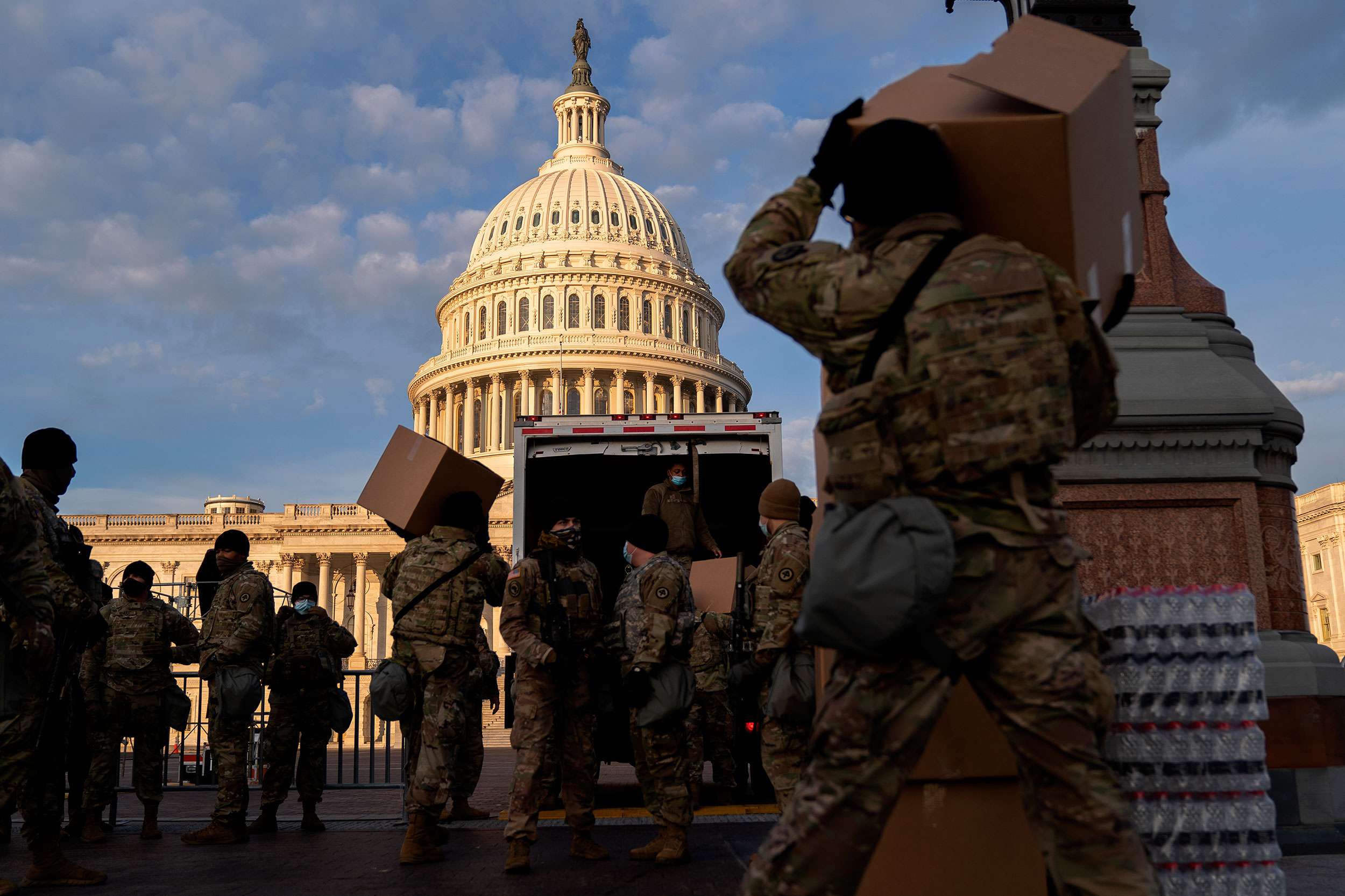 National Guard members unload supplies outside the US Capitol on January 14, in Washington, DC. 