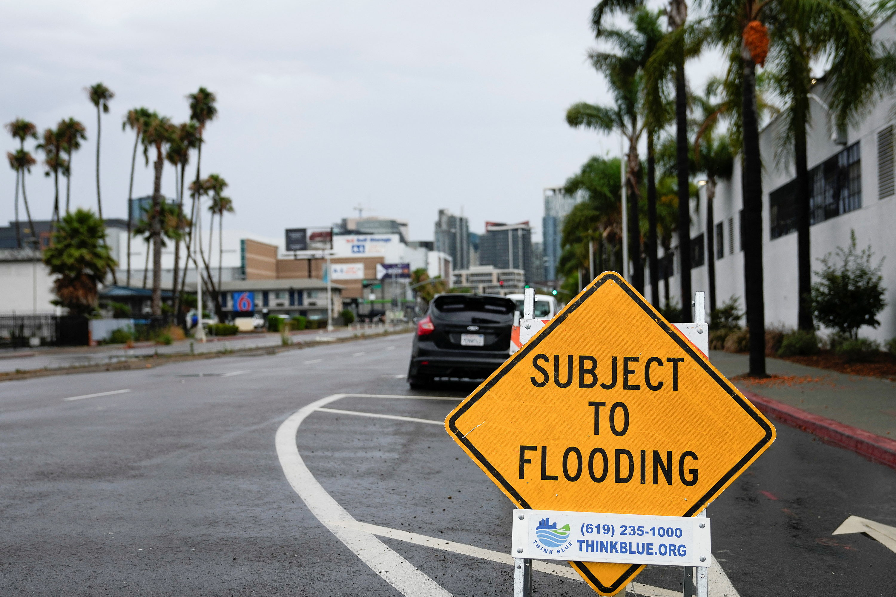 A sign warns motorists of flooding, as Tropical Storm Hilary approaches San Diego, California on Sunday. 