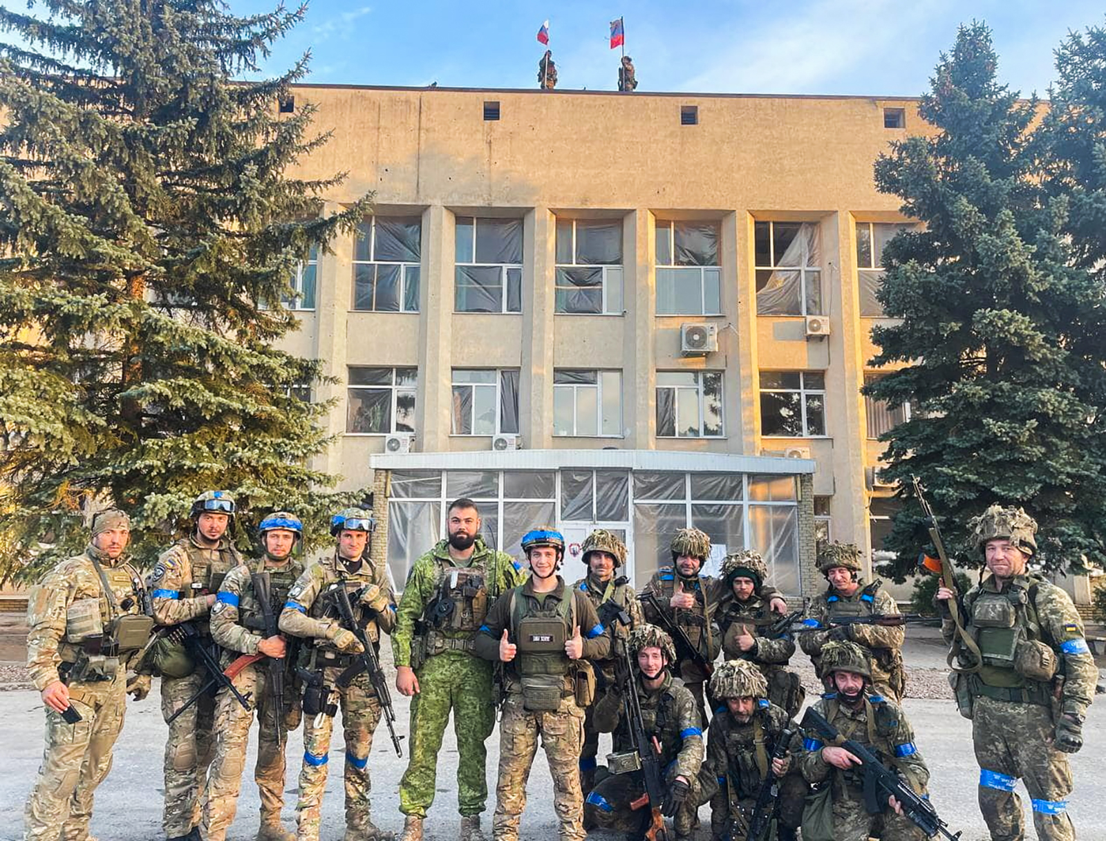 Ukrainian troops pose for a photo in Lyman on October 1.