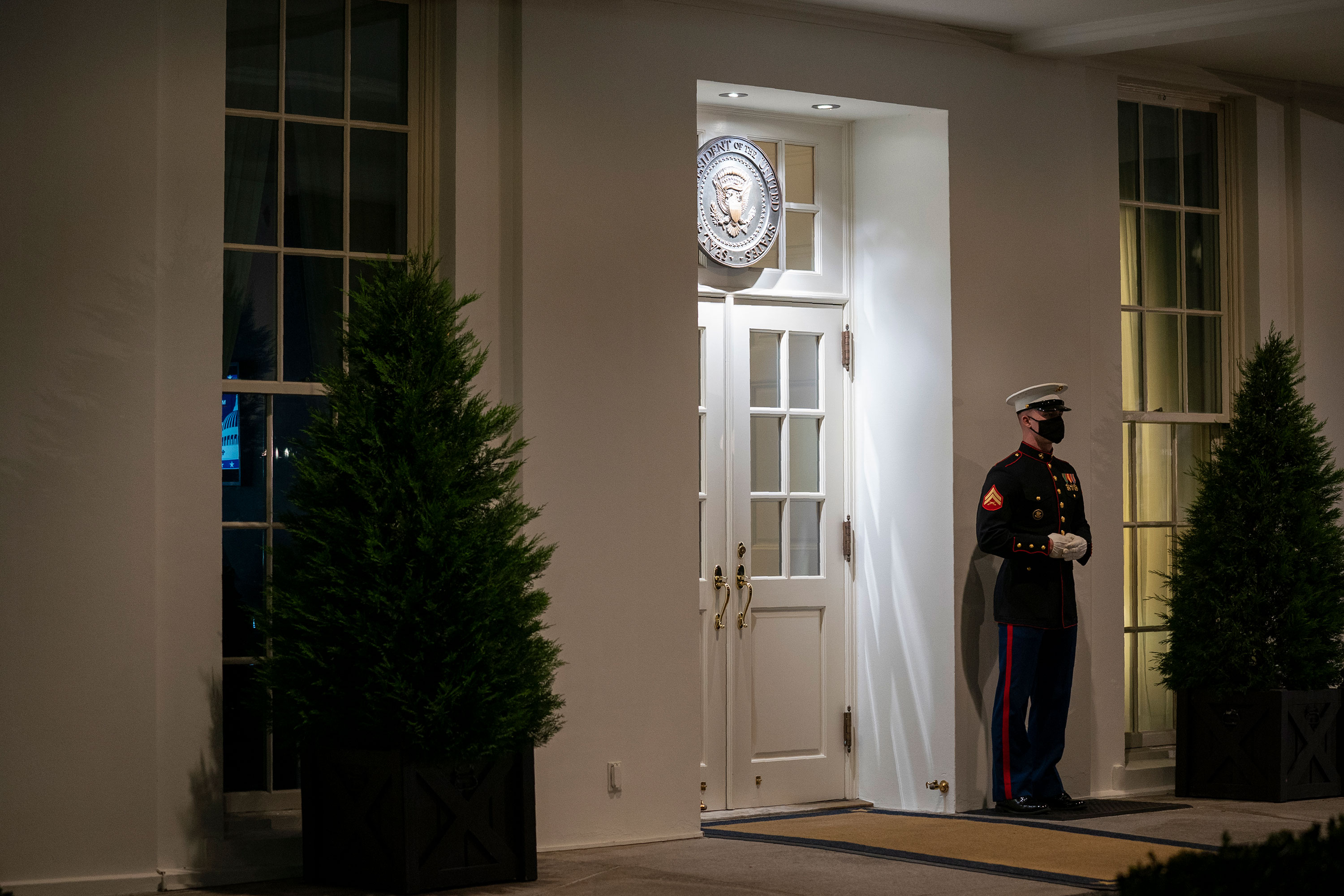 A Marine stands outside the entrance to the West Wing of the White House, signifying that President Donald Trump is in the Oval Office on November 10.
