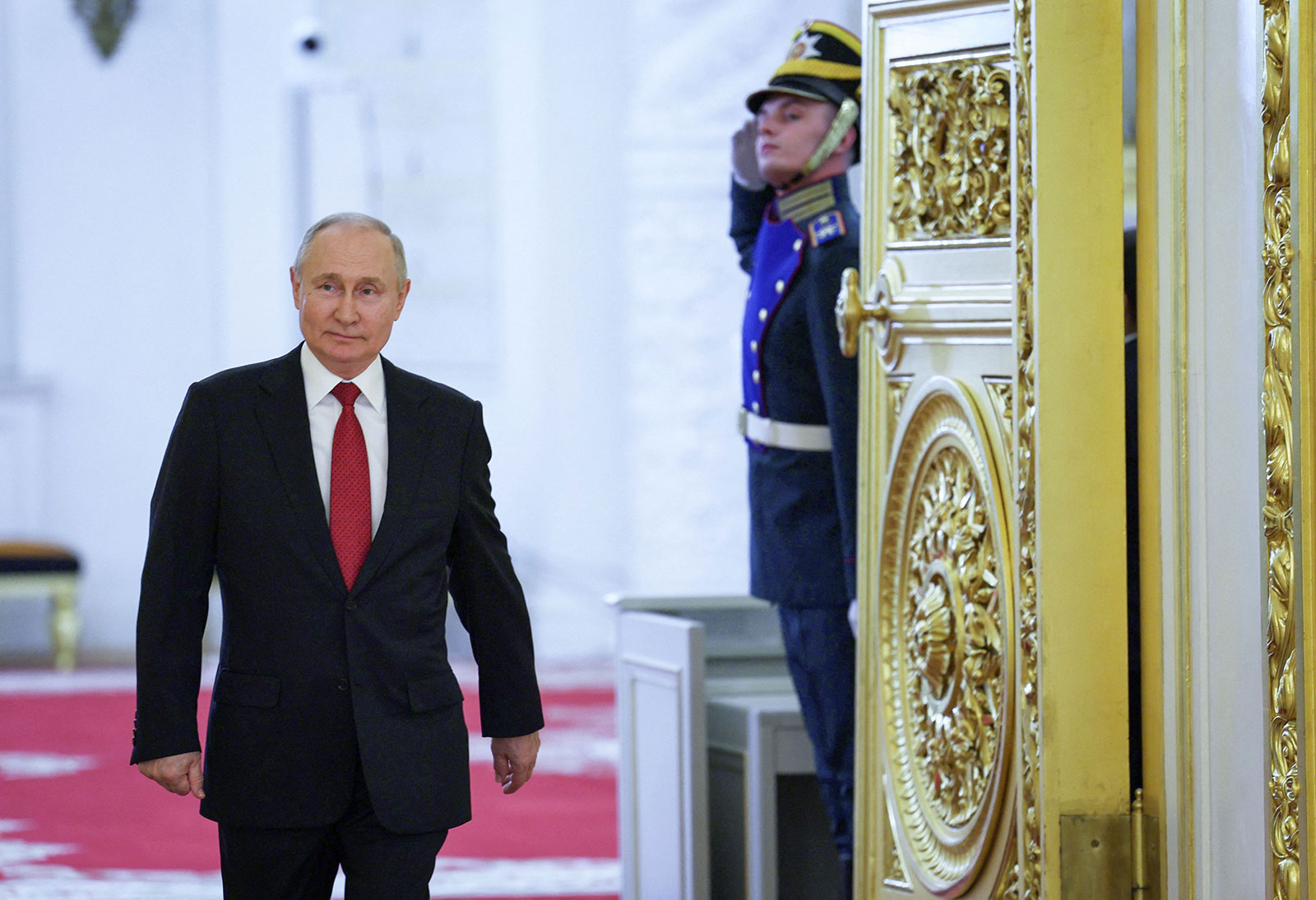 Russian President Vladimir Putin arrives for a meeting with graduates from Russia's military academies at the Kremlin in Moscow on June 21.