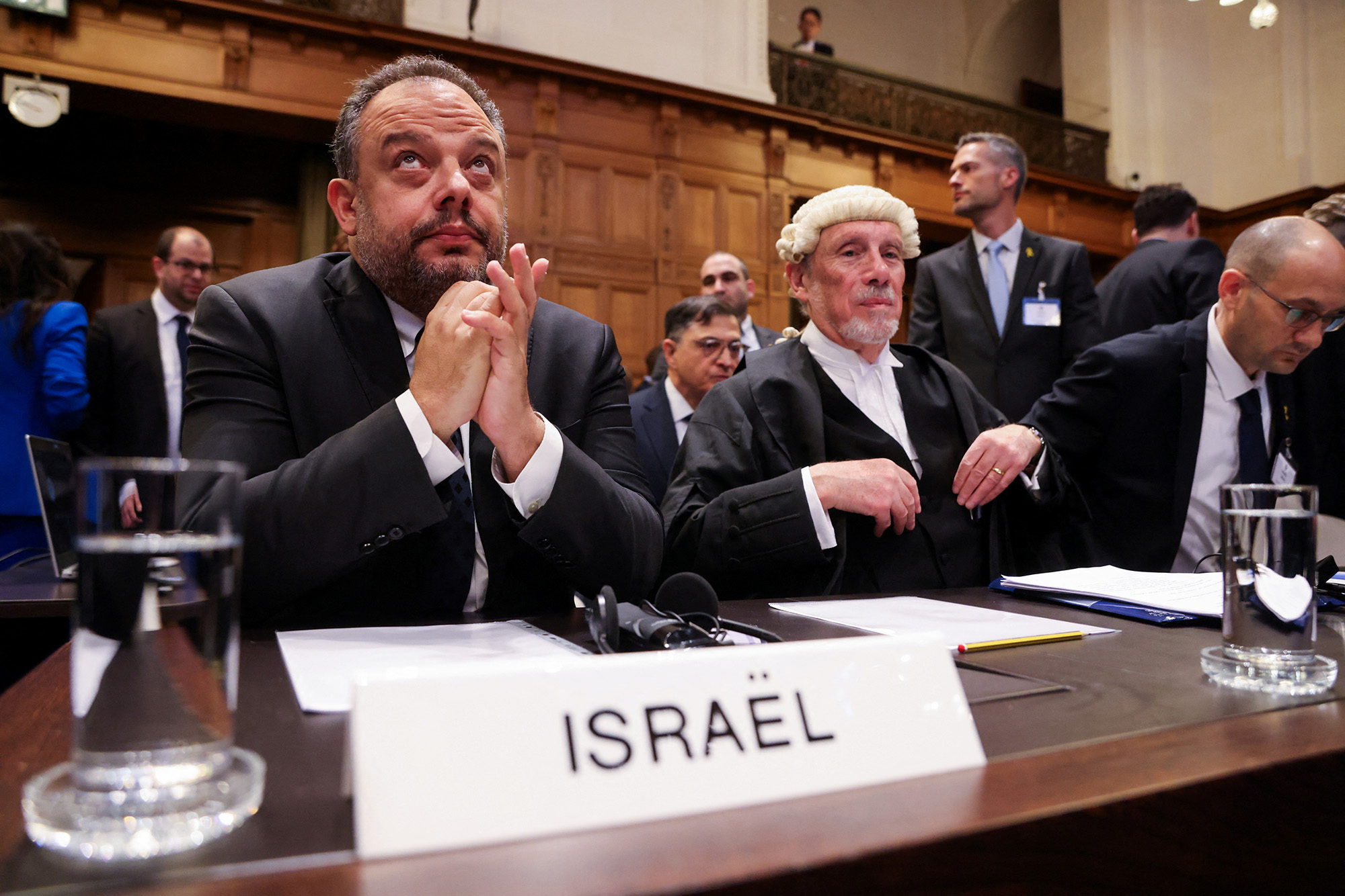 Legal adviser to Israel's Foreign Ministry Tal Becker, left, and British jurist Malcolm Shaw sit inside the International Court of Justice (ICJ) as judges hear a request for emergency measures to order Israel to stop its military actions in Gaza, in The Hague, Netherlands, on January 12.