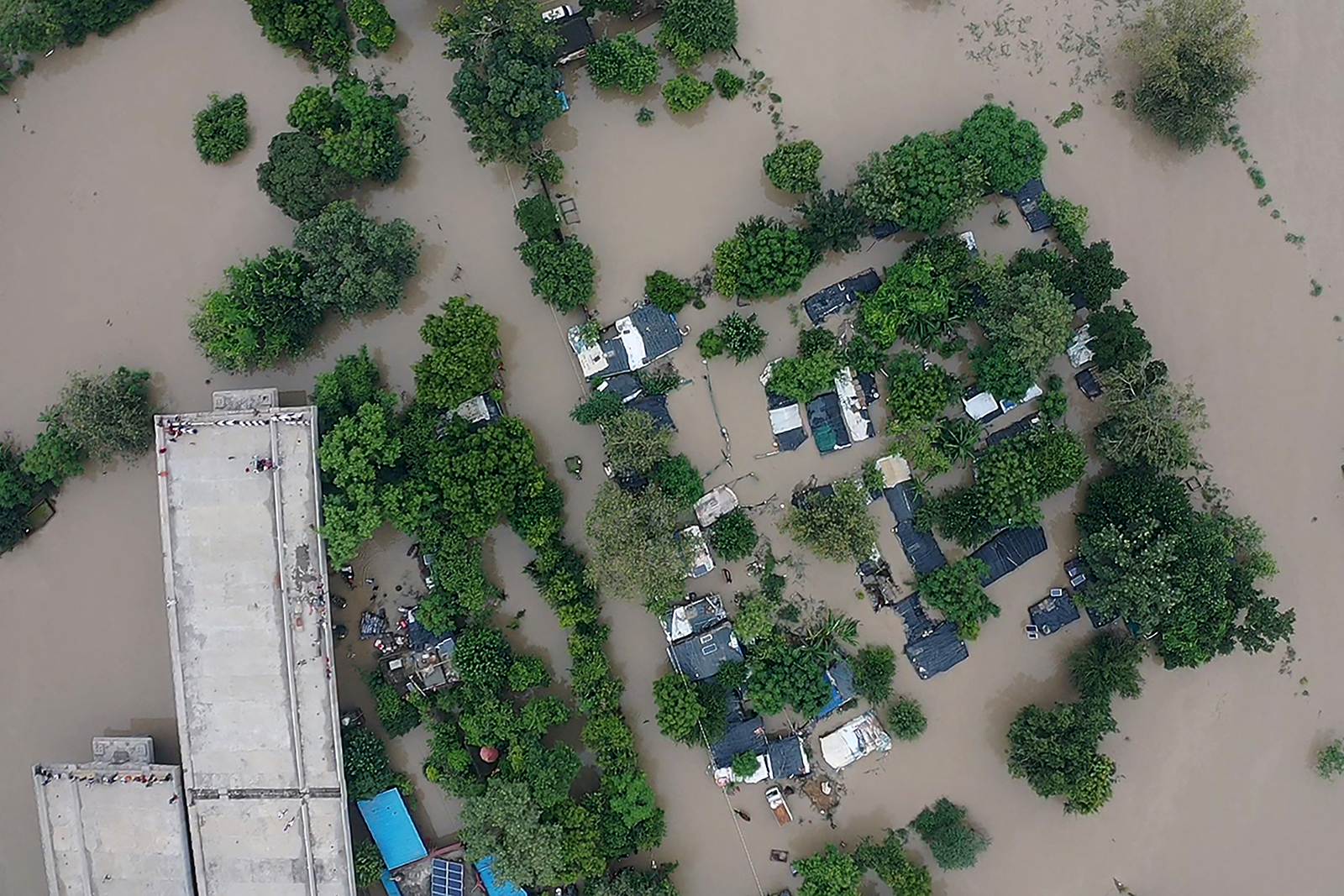 In this aerial view flooded houses are seen after the water level of the Yamuna River rose following heavy monsoon rains in New Delhi on July 14.