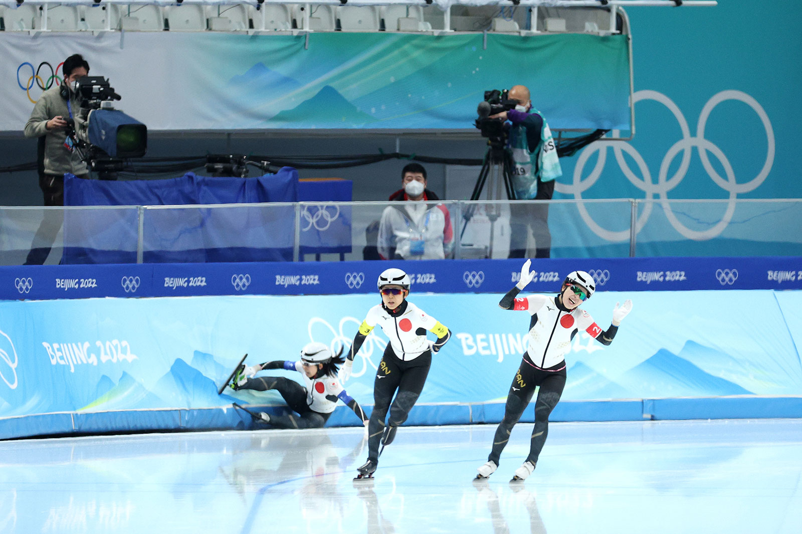 Japan's Ayano Sato and Miho Takagi react after their teammate Nana Takagi fell in the women's team pursuit final on February 15.
