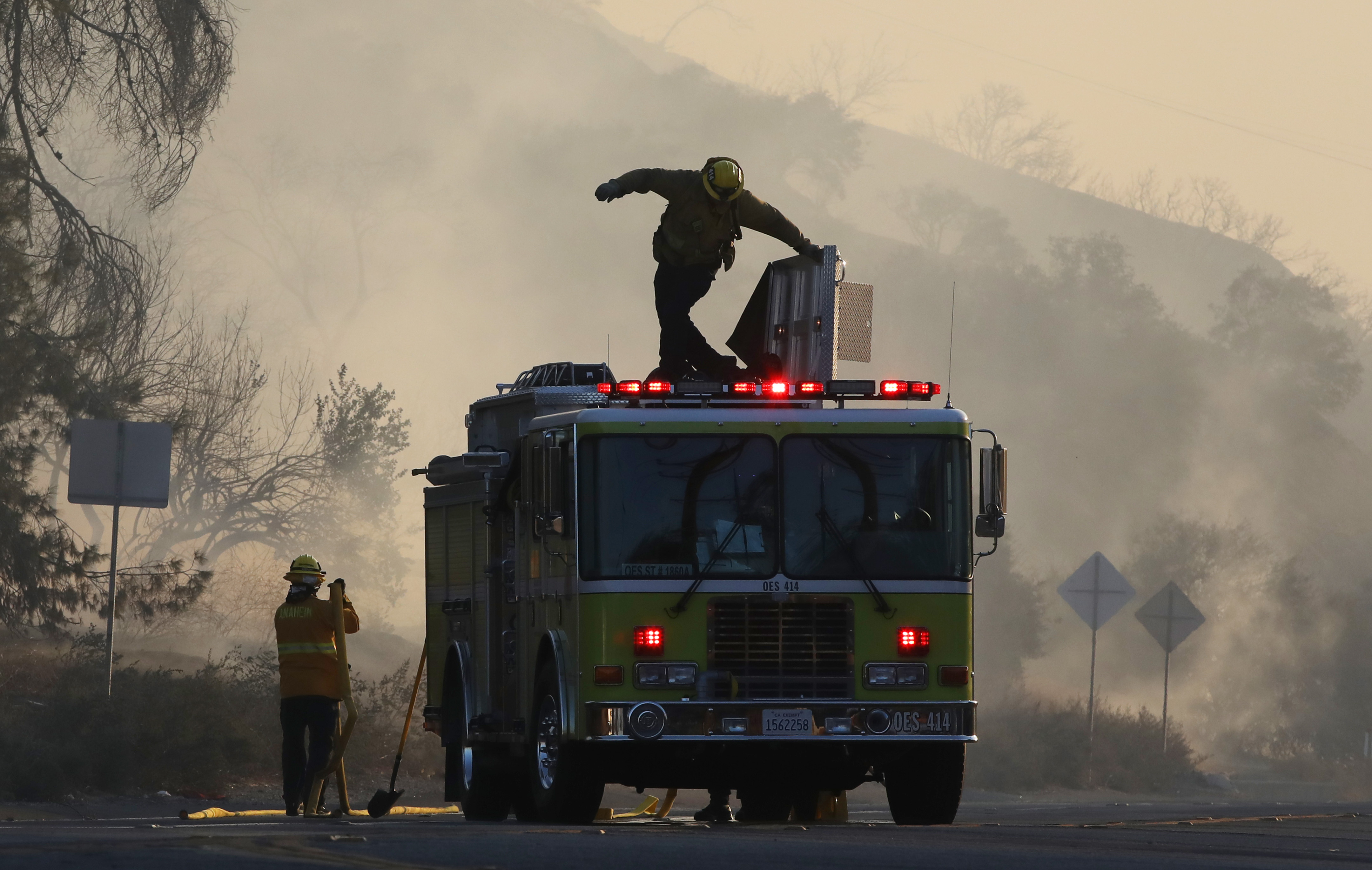 Firefighters work during the Tick Fire on October 24, 2019 in Canyon Country, California. 