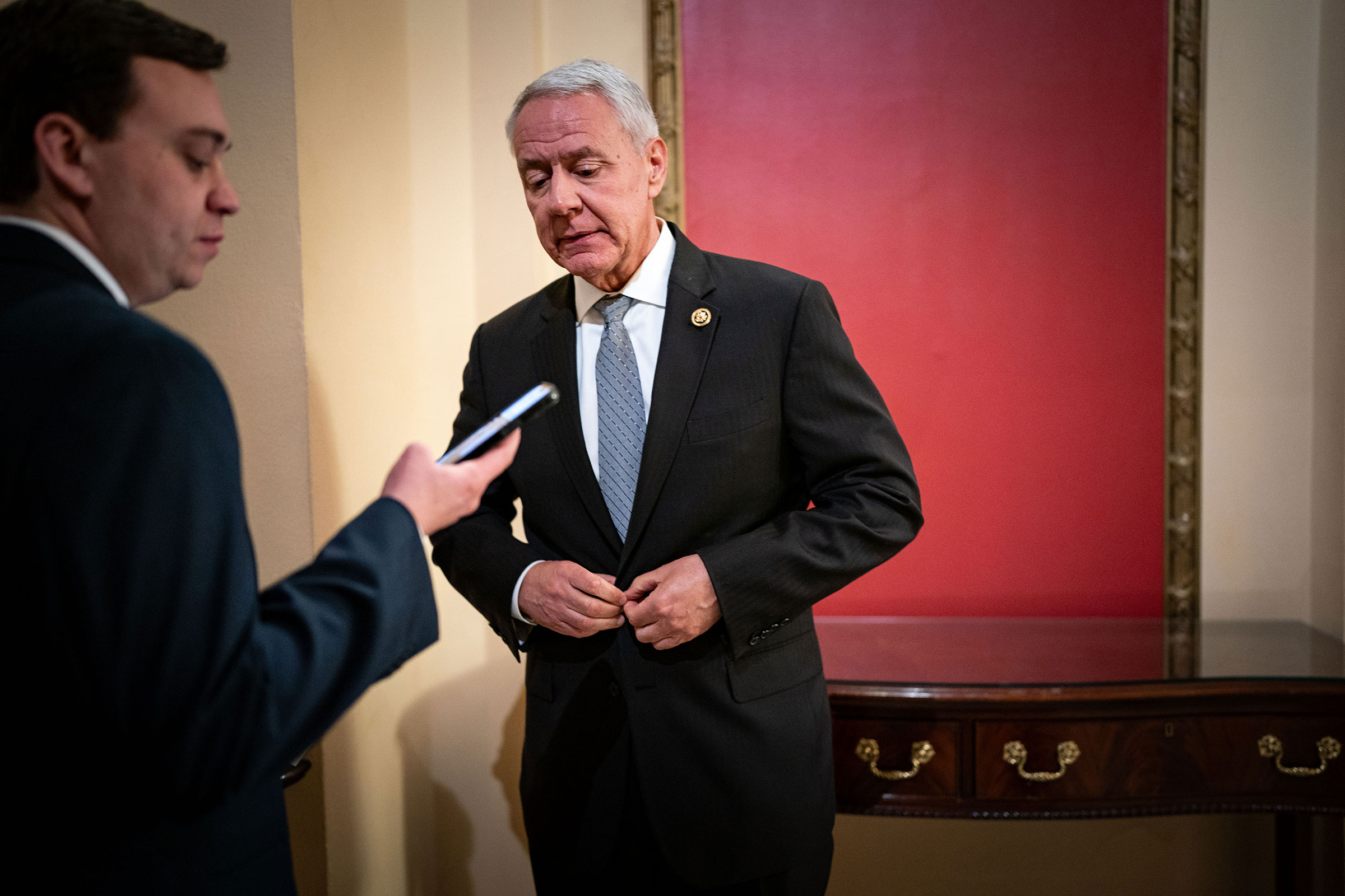 Rep. Ken Buck chats with staff before doing another television interview on the House side of the US Capitol on February 6 in Washington, DC. 