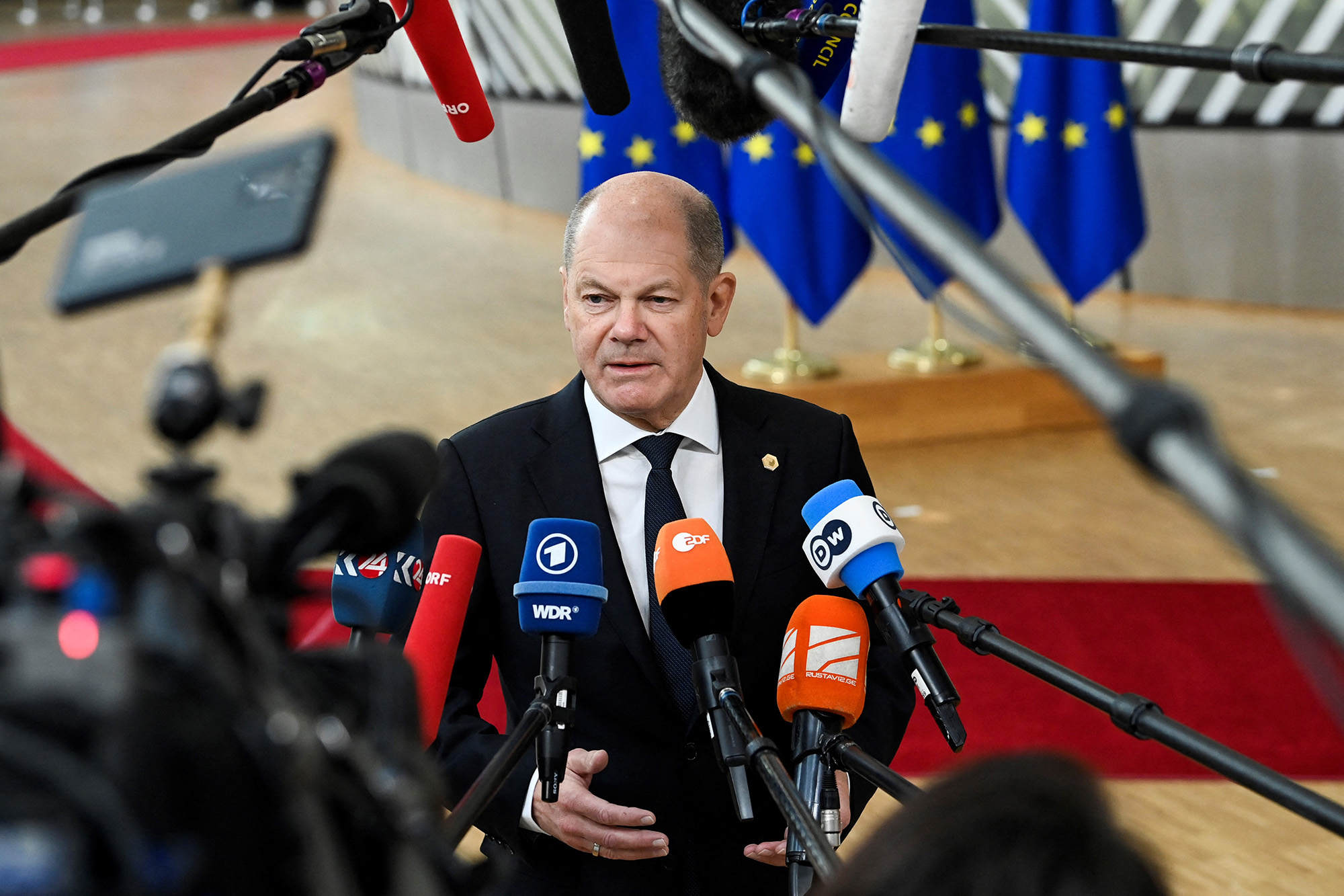 Germany's Chancellor Olaf Scholz answers journalists' questions as he arrives for a summit at EU parliament in Brussels, Belgium, on February 9.