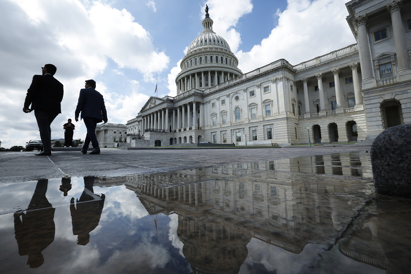 People walk past the U.S. Capitol on September 11, 2023 in Washington, DC.