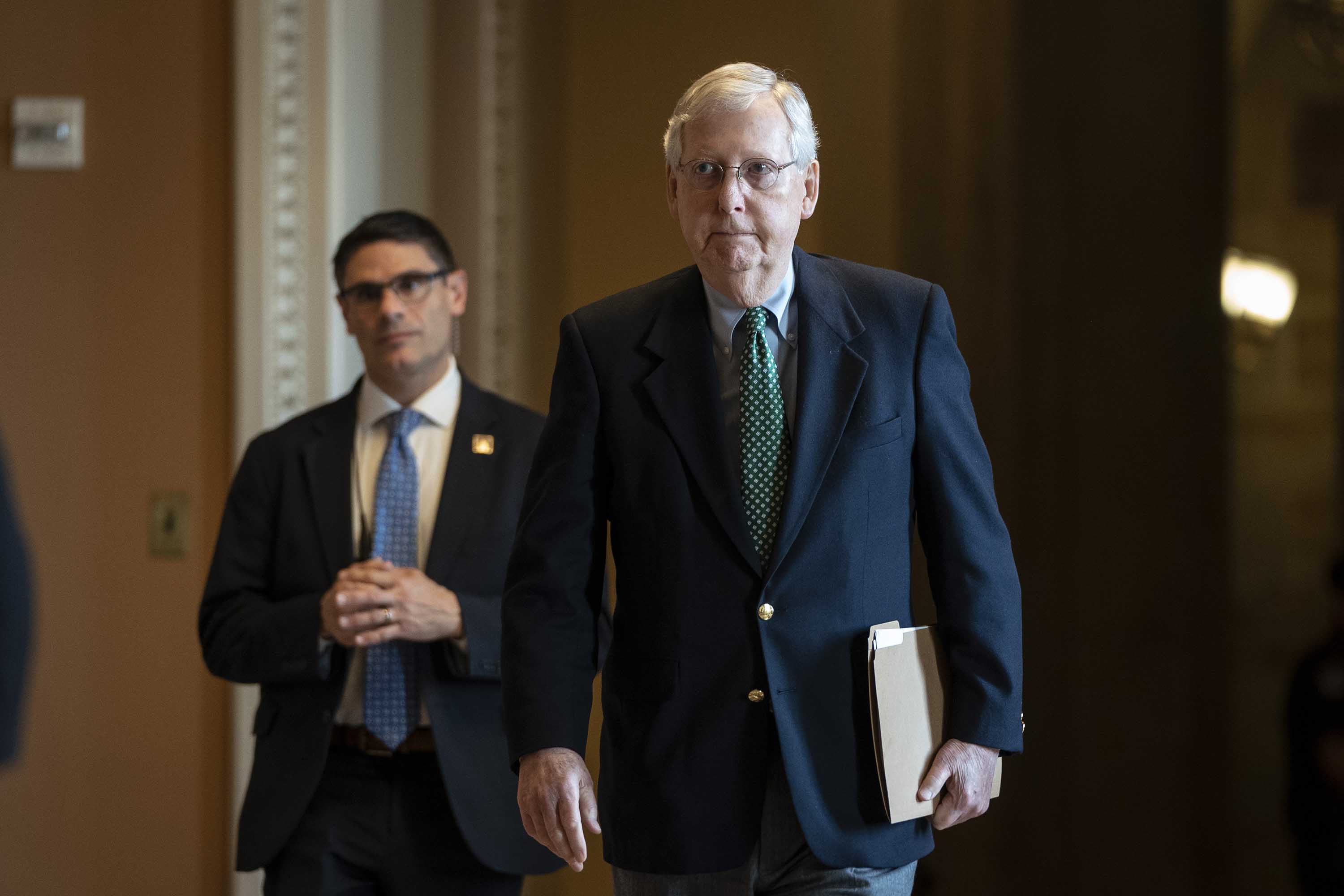Senate Majority Leader Mitch McConnell leaves his office and walks to the Senate floor at the U.S. Capitol on March 16.