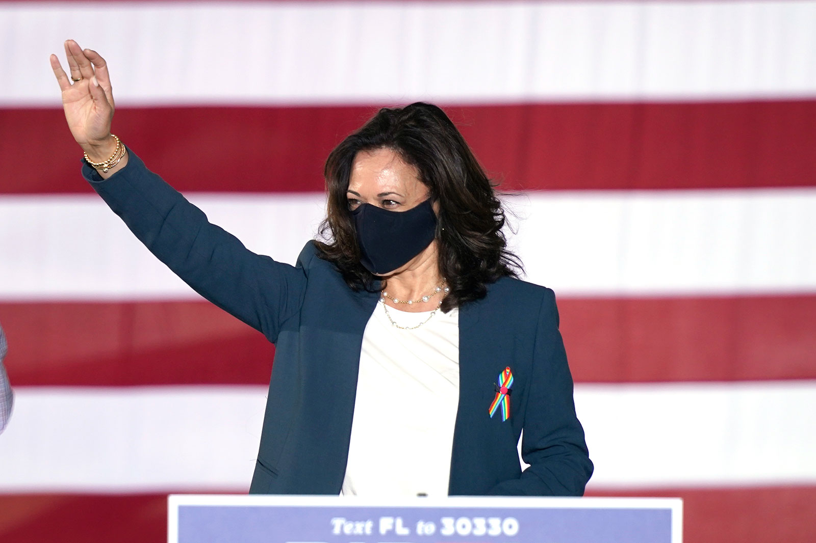 Sen. Kamala Harris waves to supporters during a campaign event in Orlando, Florida, on October 19.