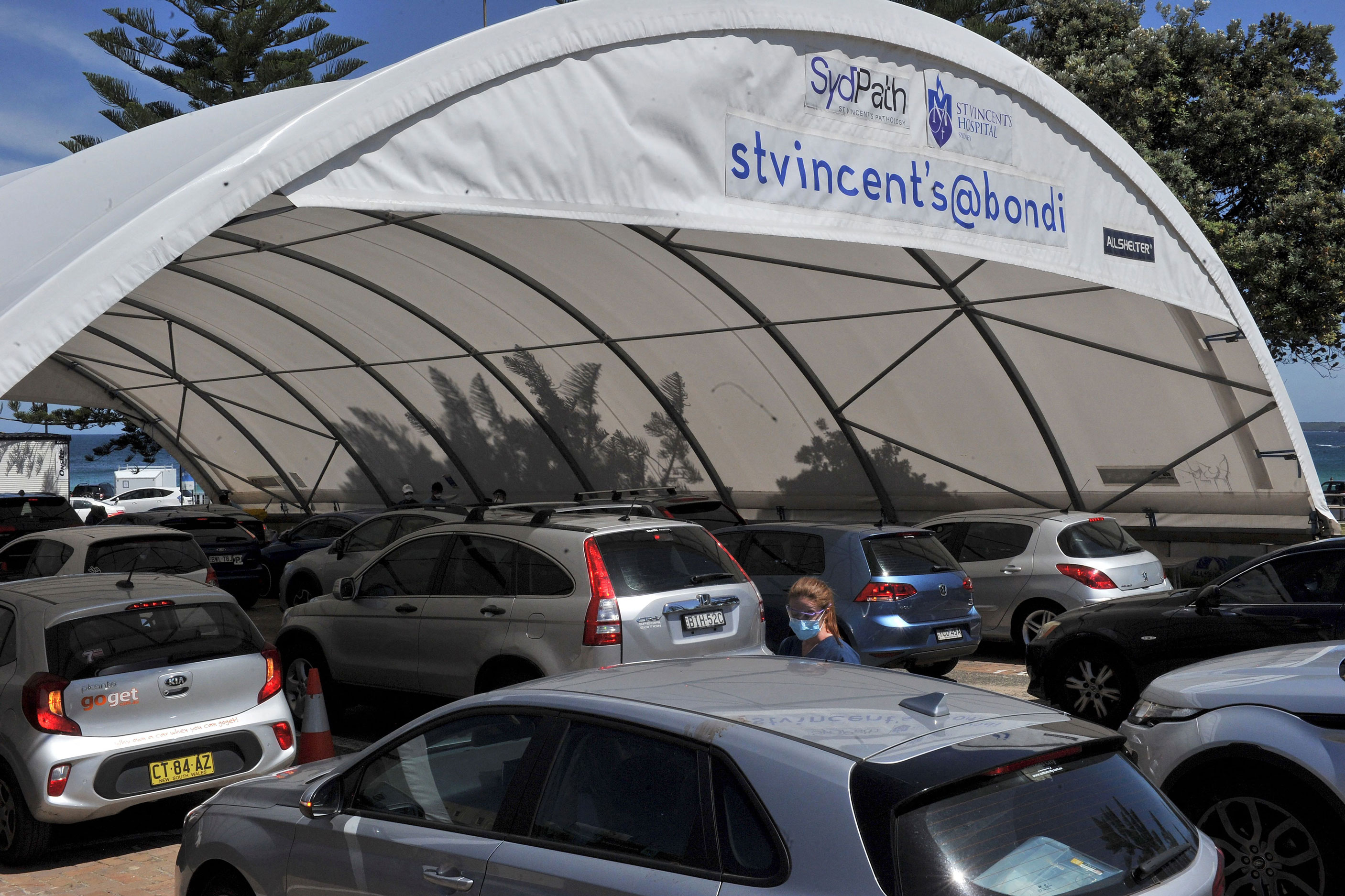 Residents queue up inside their cars for PCR tests at the St Vincent's Bondi Beach COVID-19 drive through testing clinic on December 22, 2021 in Sydney.