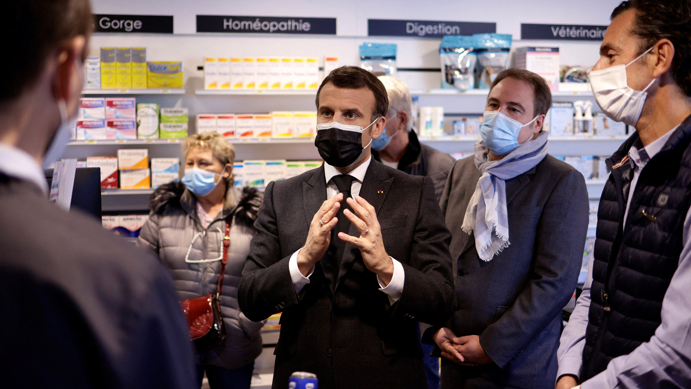 French President Emmanuel Macron visits a pharmacy in Valenciennes, France, on March 23. 